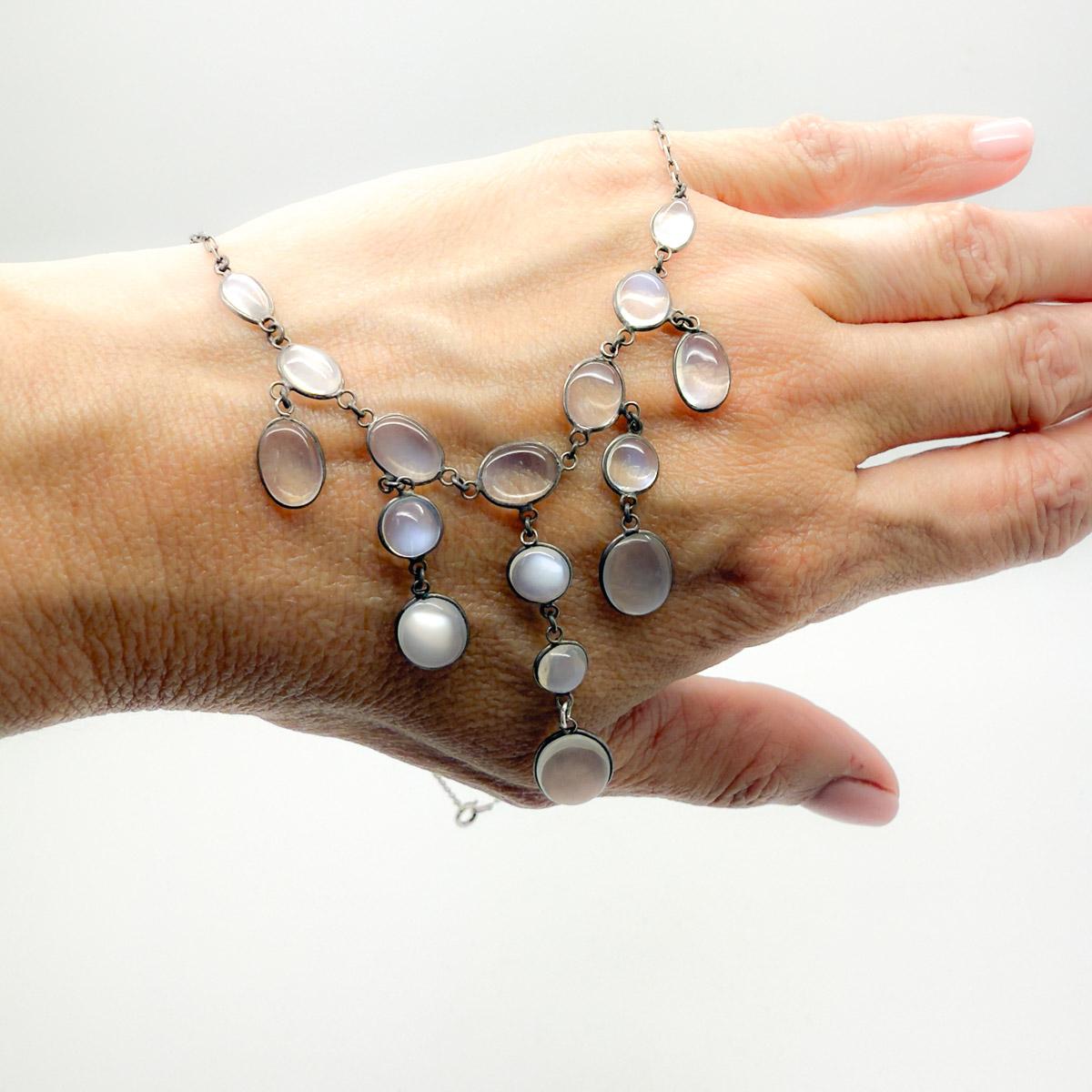 	
A beautiful Antique Silver Moonstone Necklace dating to around the 1900s and the Edwardian era - also referred to as the Arts & Crafts period.

Moonstone necklaces were popular during the Arts and Crafts period due to a combination of factors: the