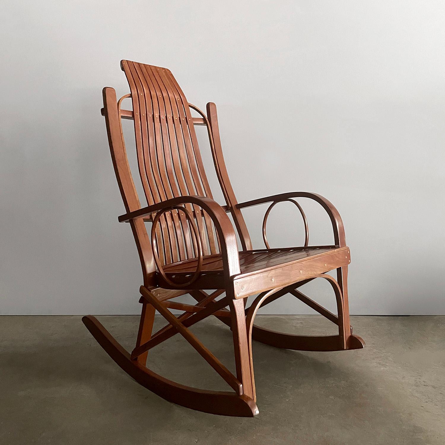 Antique arts & crafts rocking chair
Beautifully handcrafted artisanal piece
This handsome chair is making us long for relaxing days in the sun room or porch with a good book
Constructed of sleek bentwood slats and finished with metal rivet details