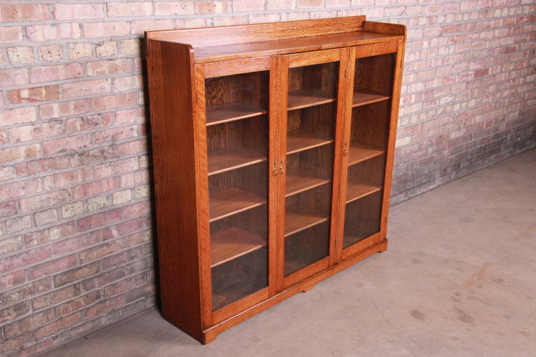 Antique Arts and Crafts Solid Oak Glass Front Triple Bookcase, circa