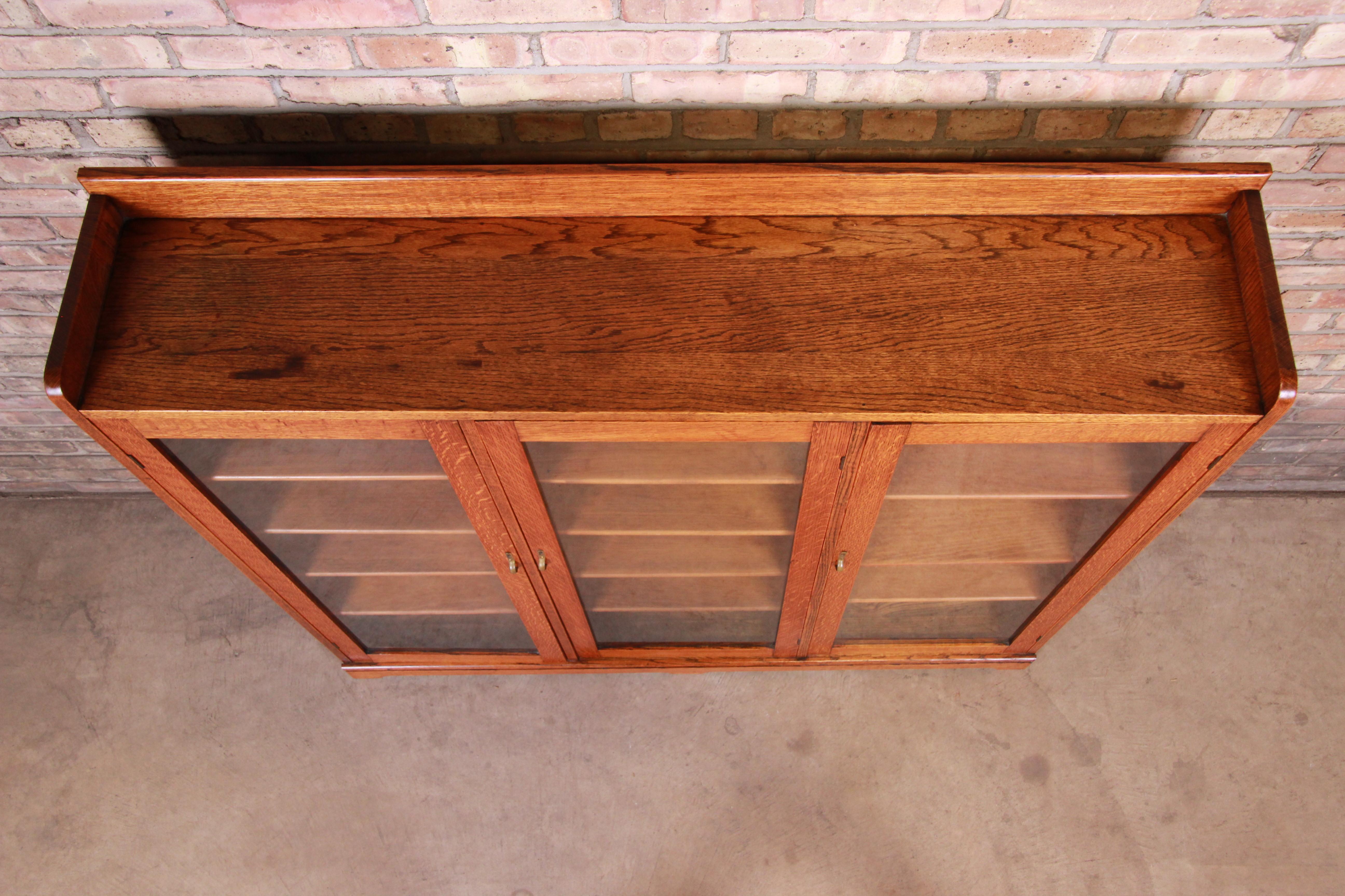 20th Century Antique Arts & Crafts Solid Oak Glass Front Triple Bookcase, circa 1900