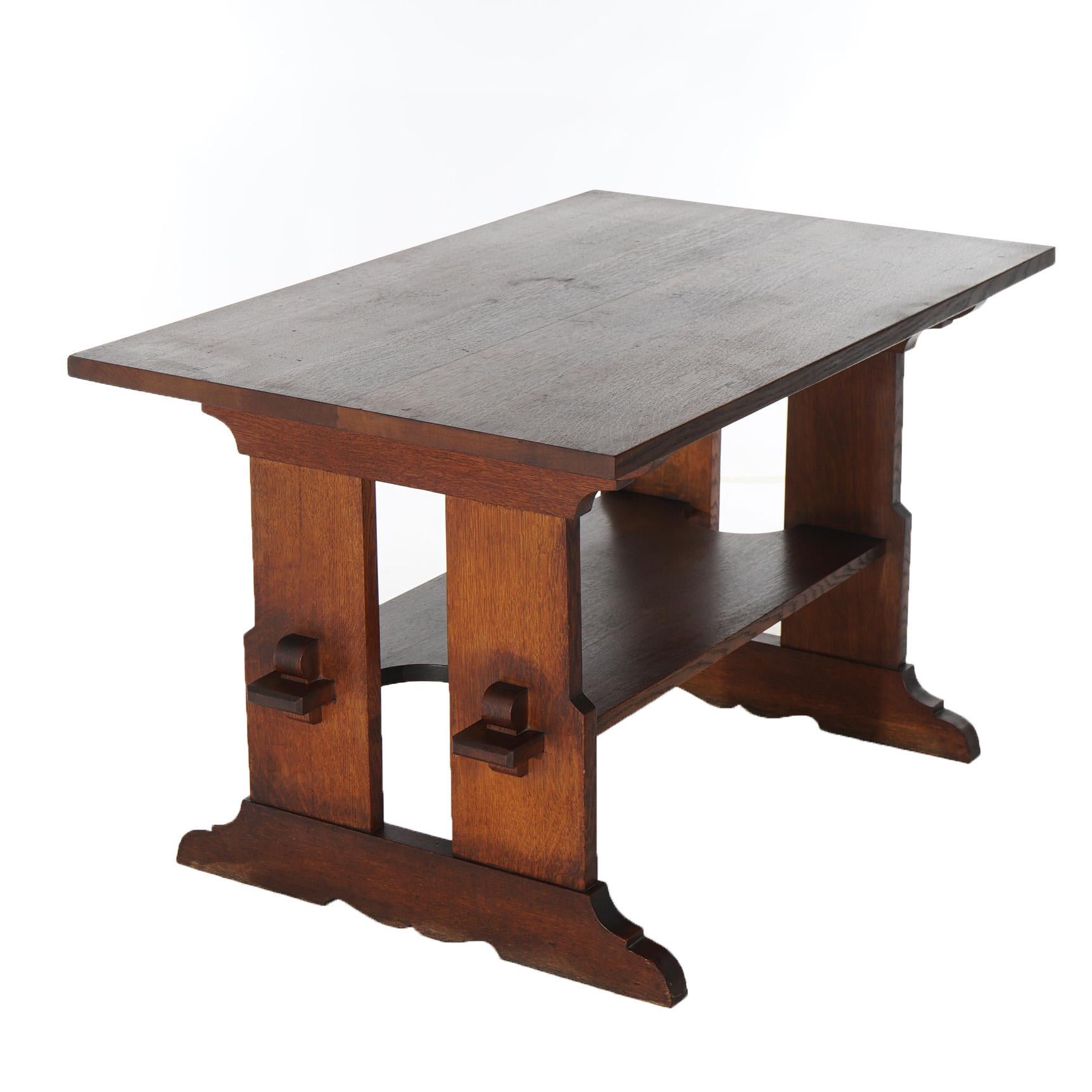 An antique Arts and Crafts Mission dinging table by Stickley offers quarter sawn oak construction in trestle style with mortise and tenon joinery, original maker label as photographed, c1910

Measures - 29