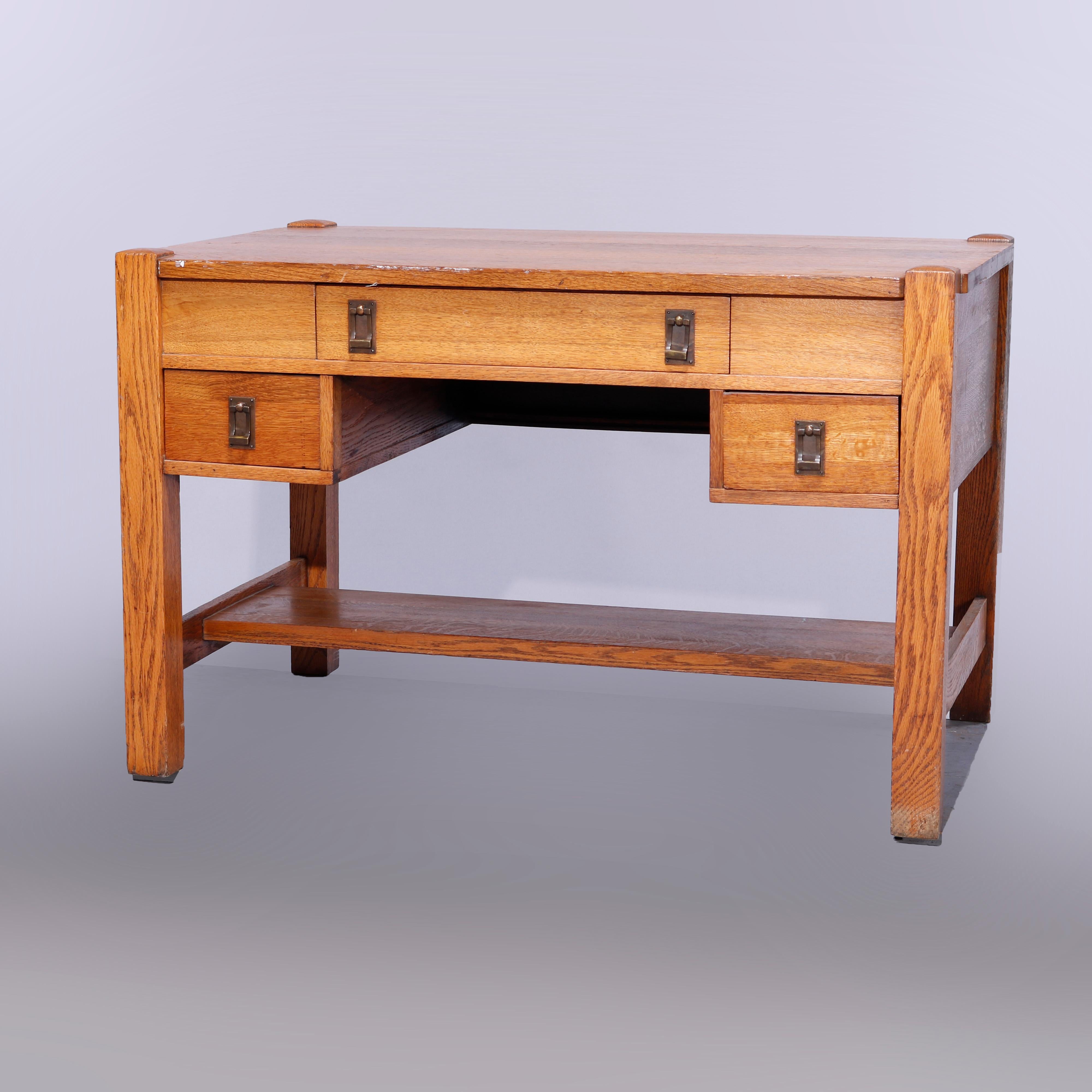 An Arts & Crafts Mission desk in the manner of Stickley offers oak construction with upper drawer having flip-top lid (art supplies) flanked by two flanking side drawers, raised on straight and square legs having shelf stretcher, c1910

Measures -
