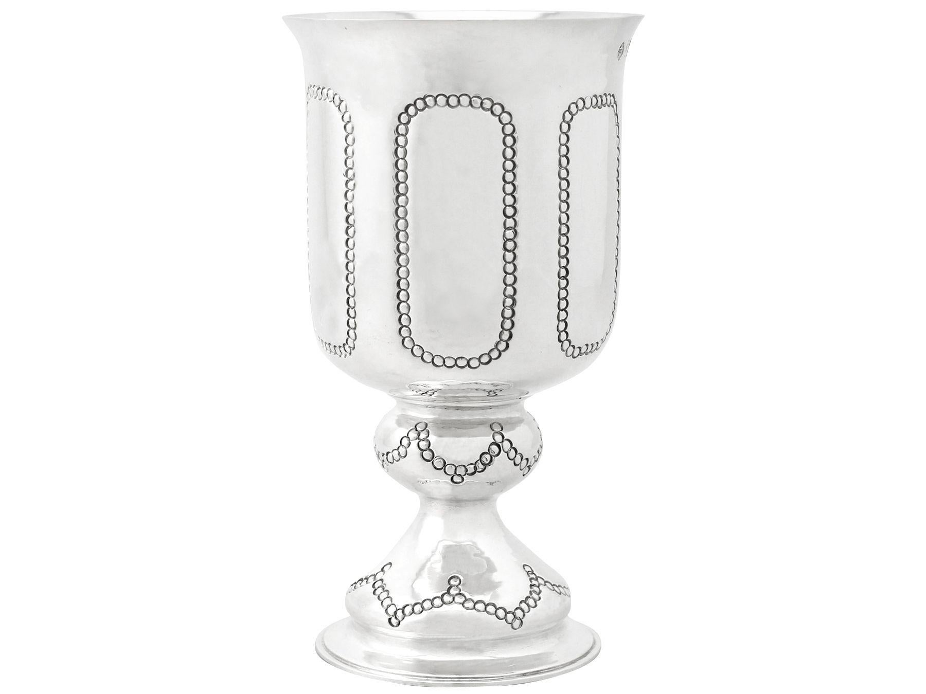 An exceptional, fine and impressive antique George V English sterling silver goblet made by C F Hancock & Co in the Arts & Crafts style; an addition to our wine and drinks related silverware collection.

This exceptional antique George V sterling