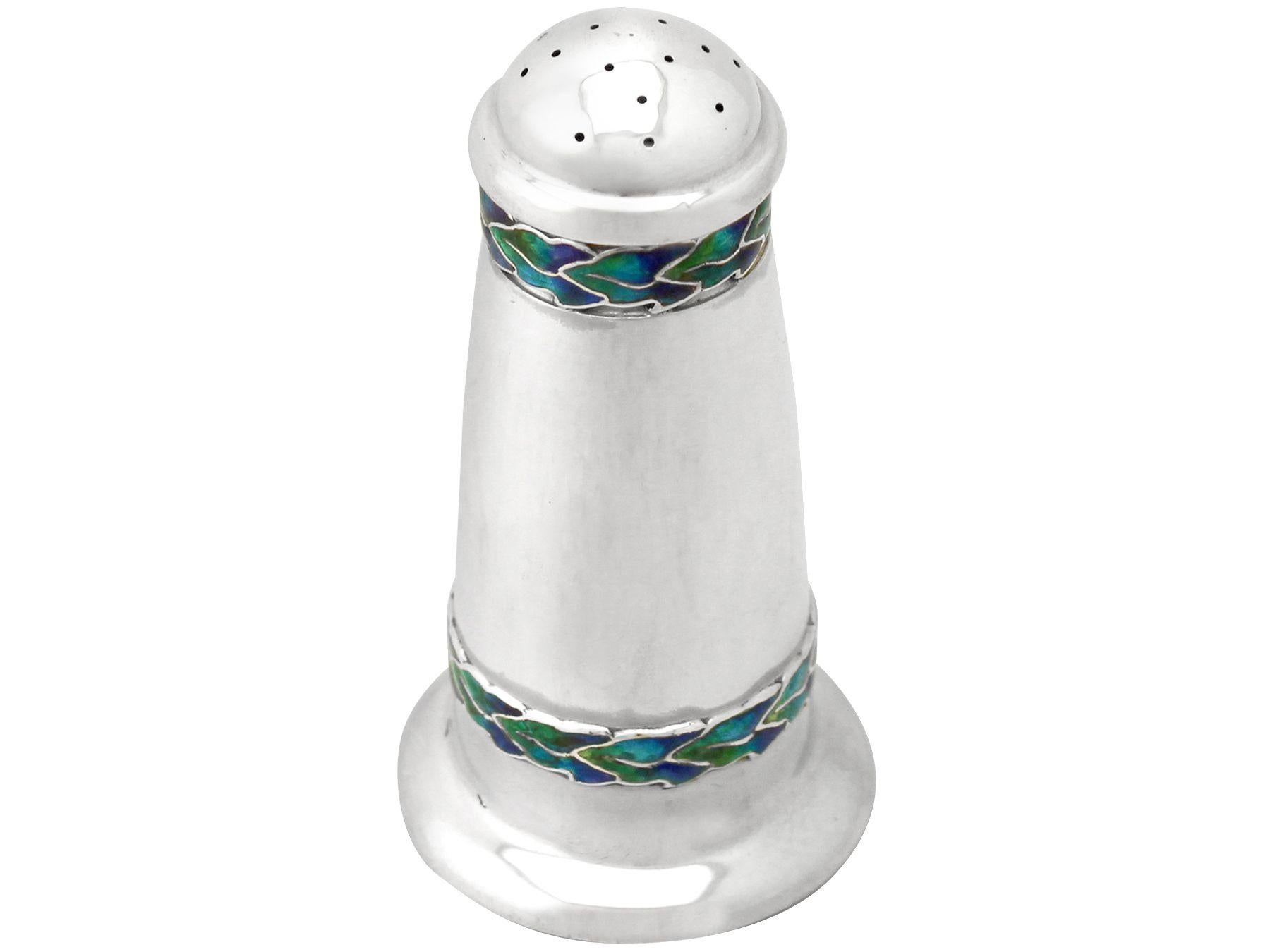 An exceptional, fine and impressive antique George V English sterling silver pepper Shaker made by Liberty & Co Ltd in the Arts & Crafts style; an addition to our silver cruets or condiments collection.

This exceptional antique George V sterling