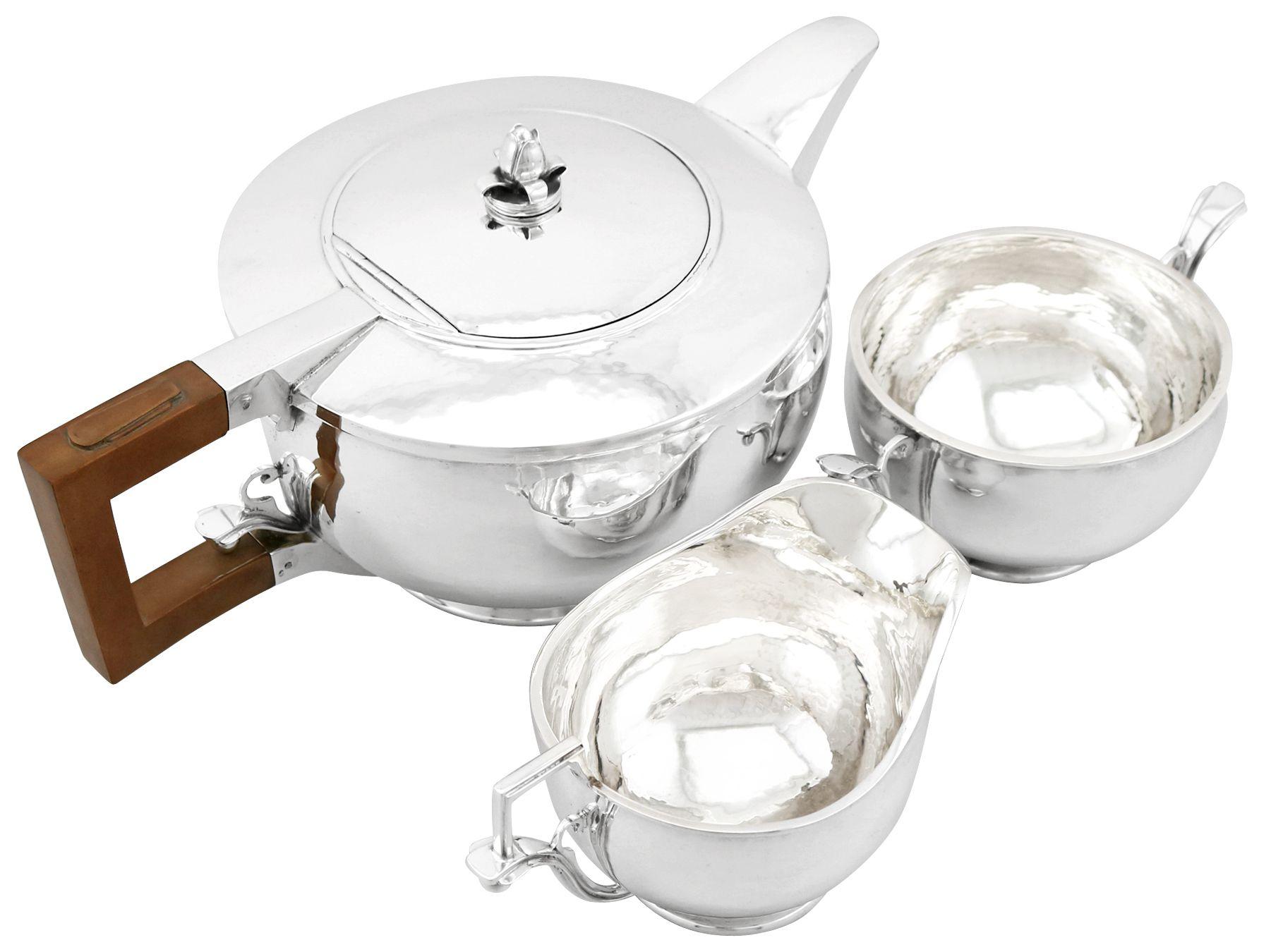 An exceptional, fine and impressive antique George V English sterling silver three-piece tea service/set made in the Arts & Crafts style; an addition to our silver teaware collection

This exceptional antique George V sterling silver three piece