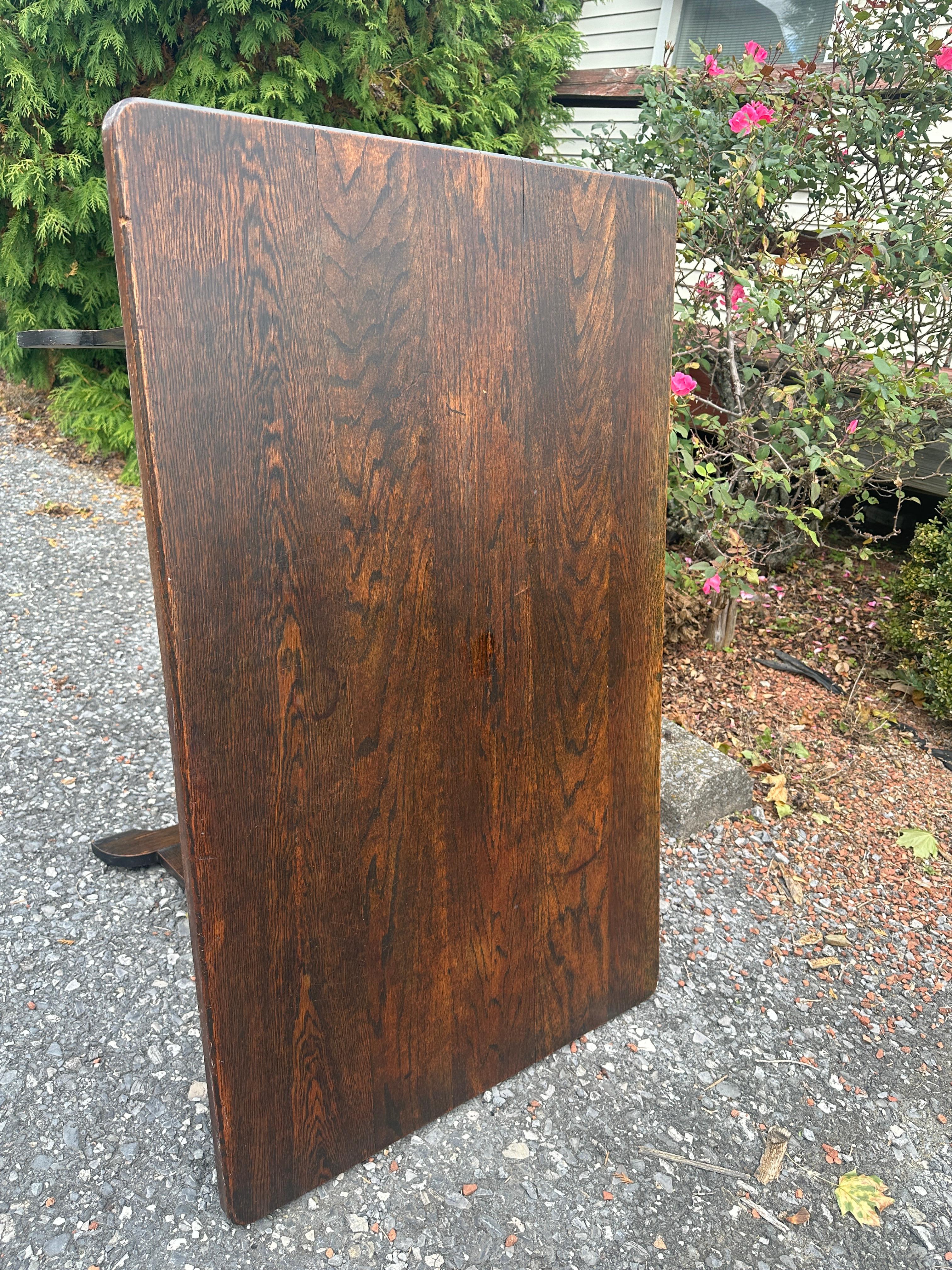 This is a nice Johnson & Son ARTS and CRAFTS table made of Oak in excellent condition.  It has the original two pins on the table.  

The tabletop can flip & make it a bench (please see photos).

STURDY & STRONG - ready for use in your