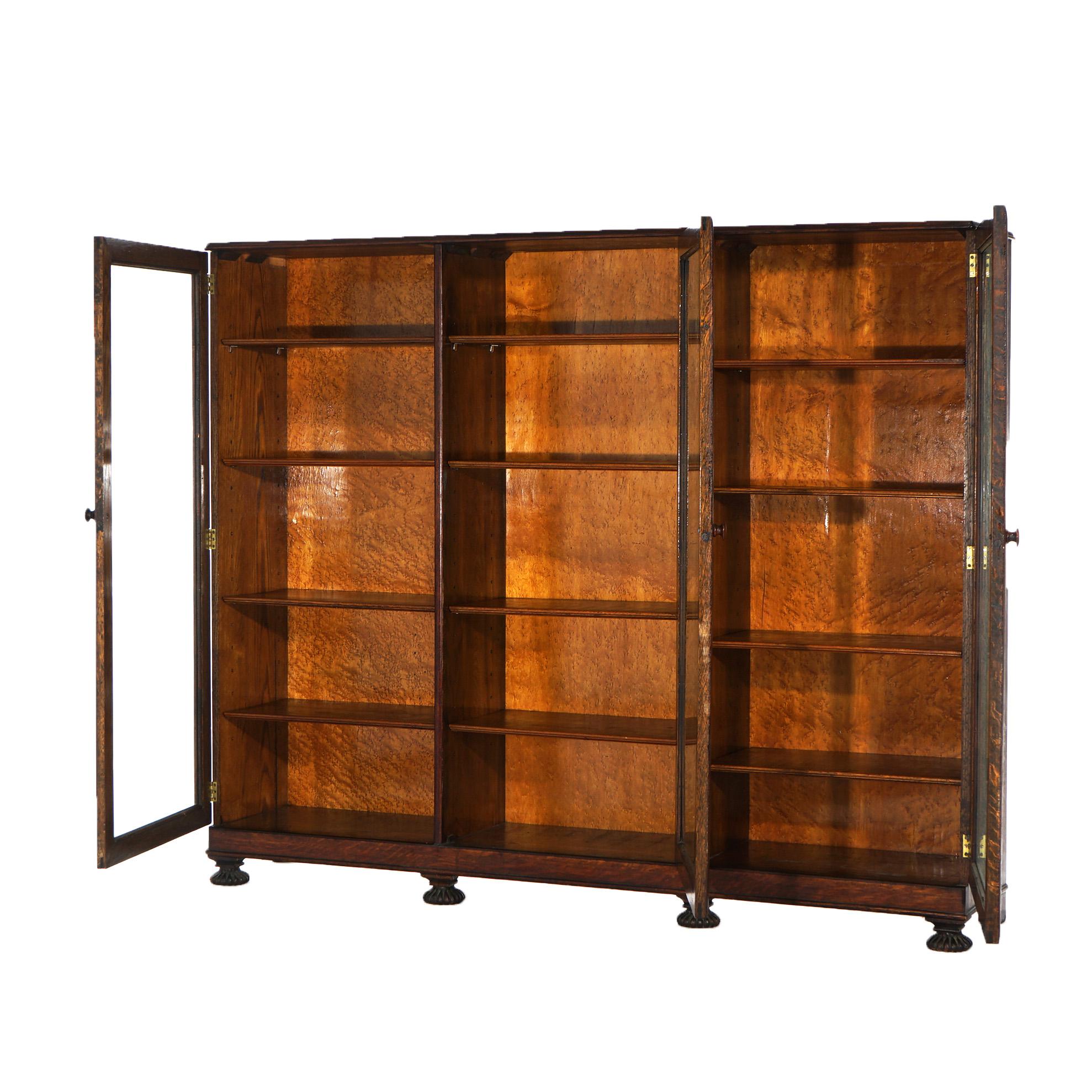 ***Inquire About Reduced In-House Delivery Rates - Reliable Professional Service & Fully Insured***
Antique Arts & Crafts Enclosed Oak Bookcase with Three Glass Doors Opening to Divided Interior having Adjustable Shelves, Raised on Carved Feet,