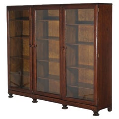 Antique Arts & Crafts Three-Door Enclosed Oak Bookcase with Carved Feet C1910
