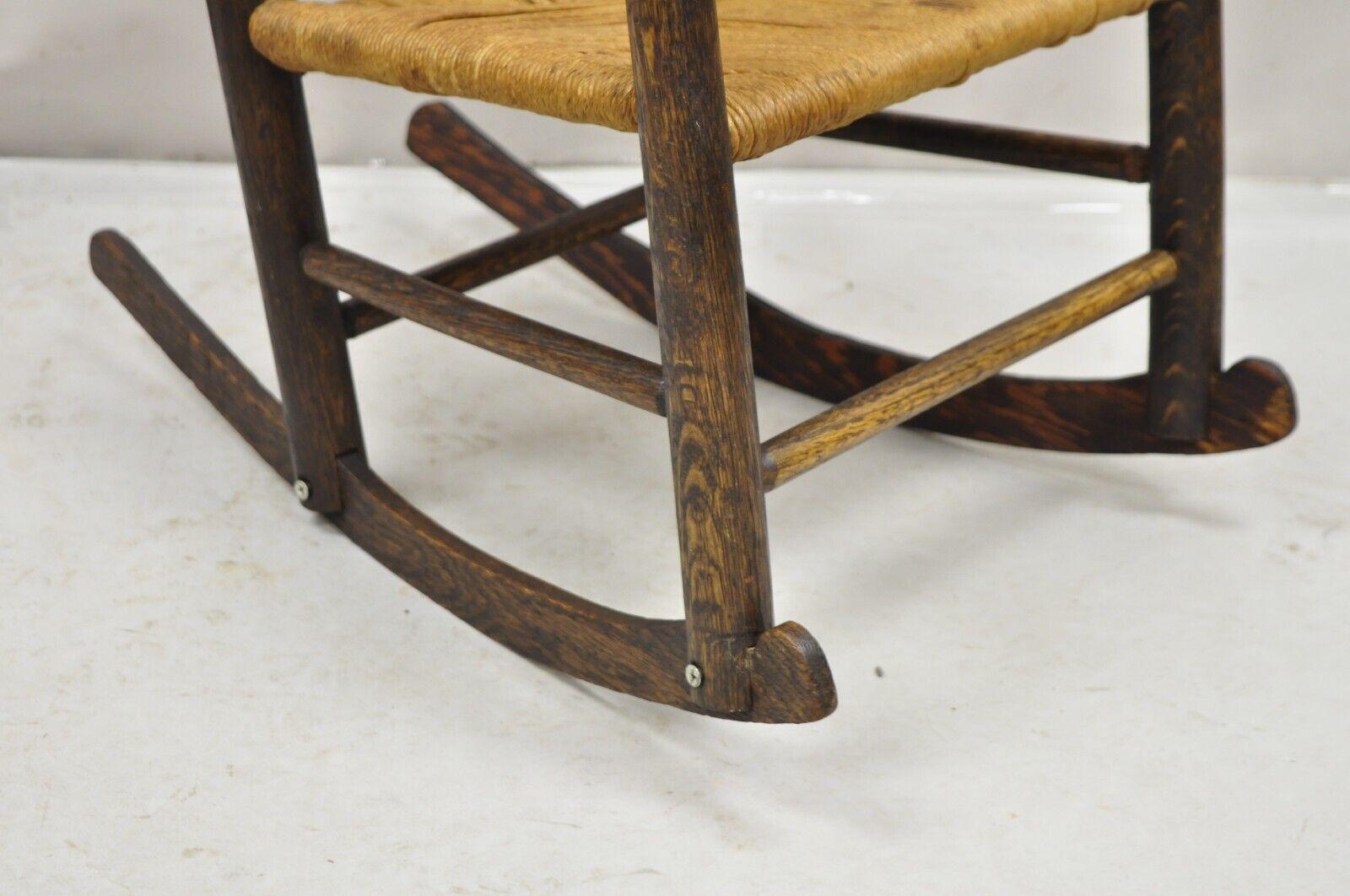 Antique Arts & Crafts Victorian Oak Wood Rush Seat Small Child's Rocking Chair In Good Condition For Sale In Philadelphia, PA