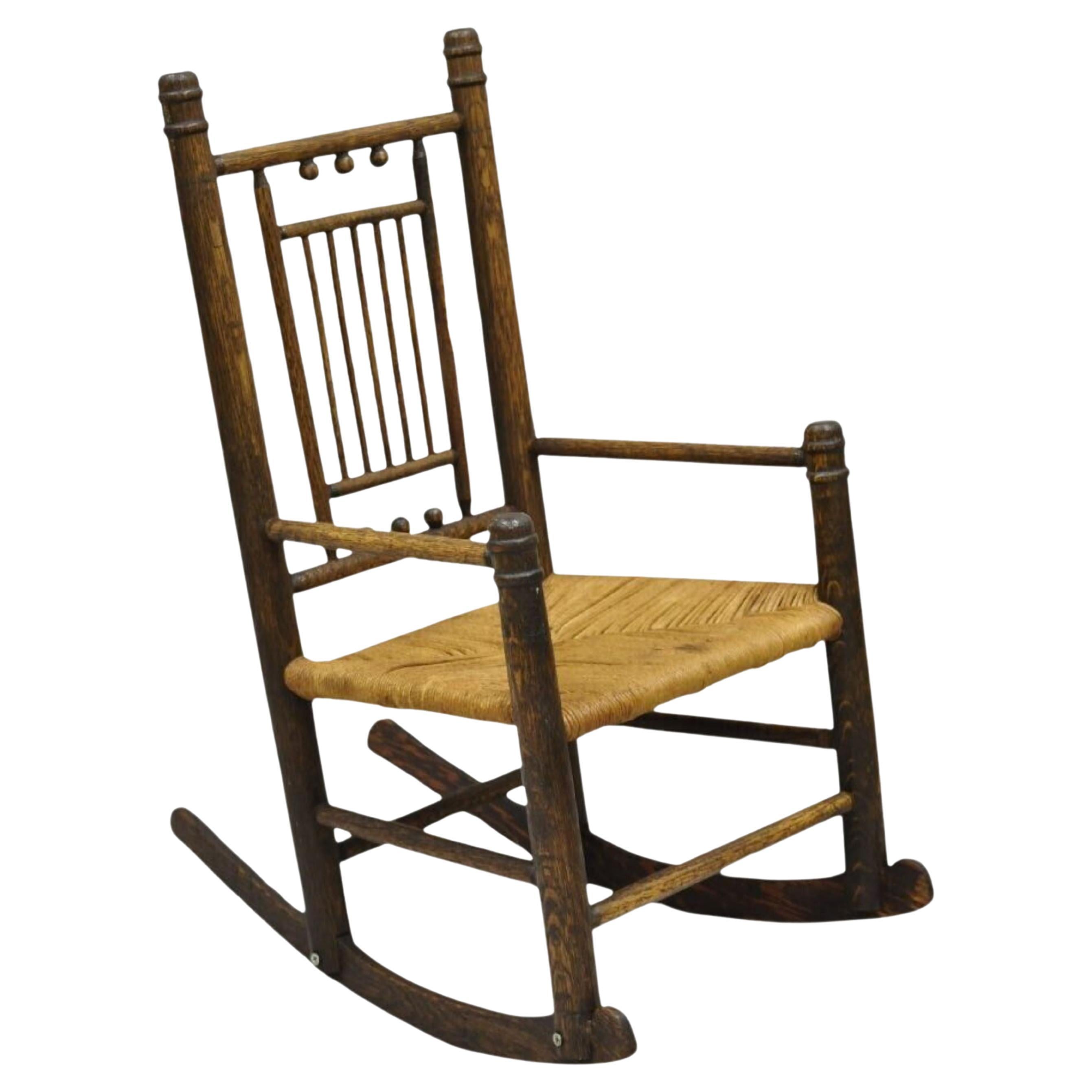 Antique Arts & Crafts Victorian Oak Wood Rush Seat Small Child's Rocking Chair For Sale