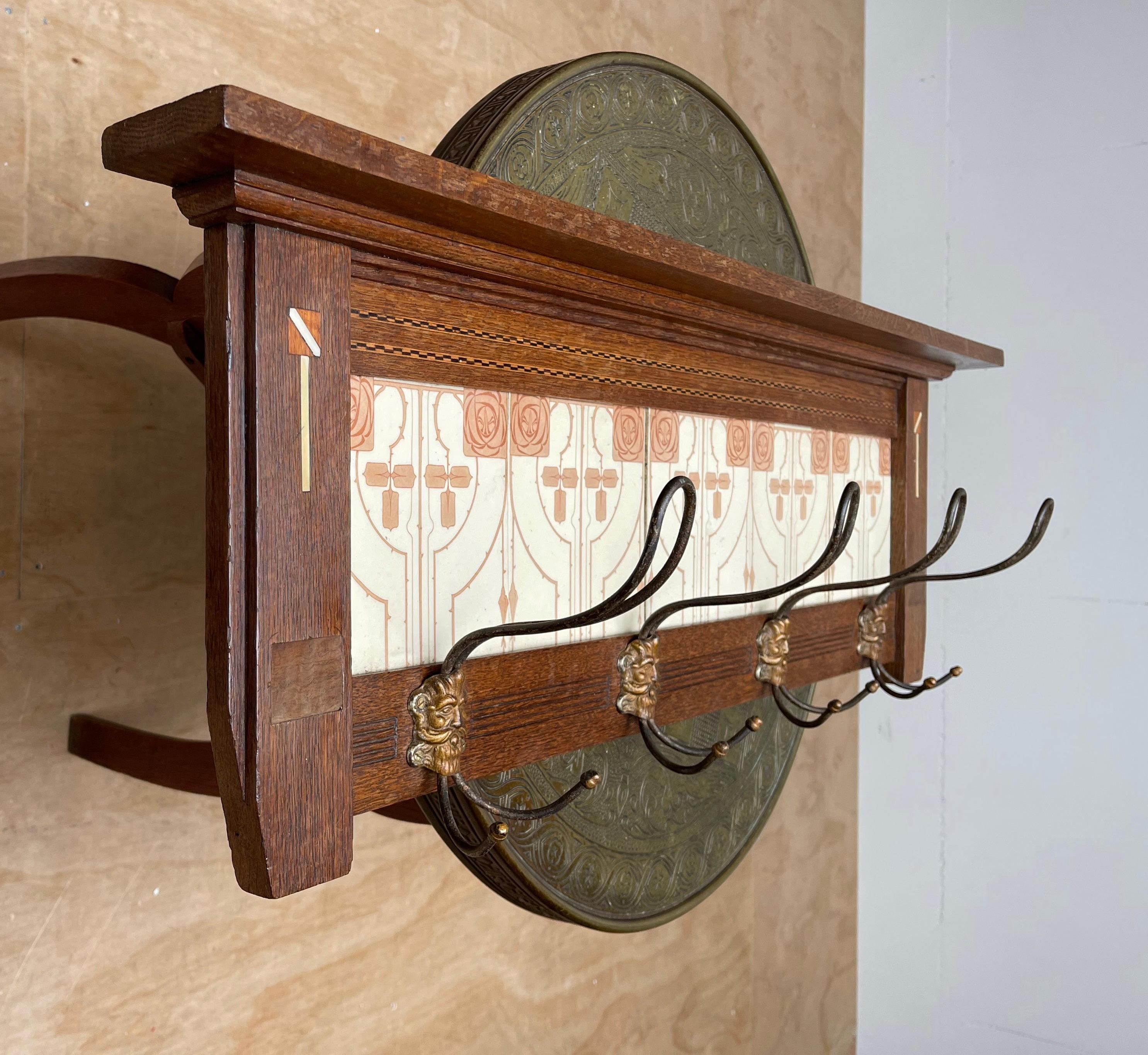Stunning design and good condition wall coat rack. 

This rare and highly stylish Arts & Crafts coat rack is entirely original and in amazing condition. Its practical size makes it also suitable for smaller entrances or even for a bedroom and