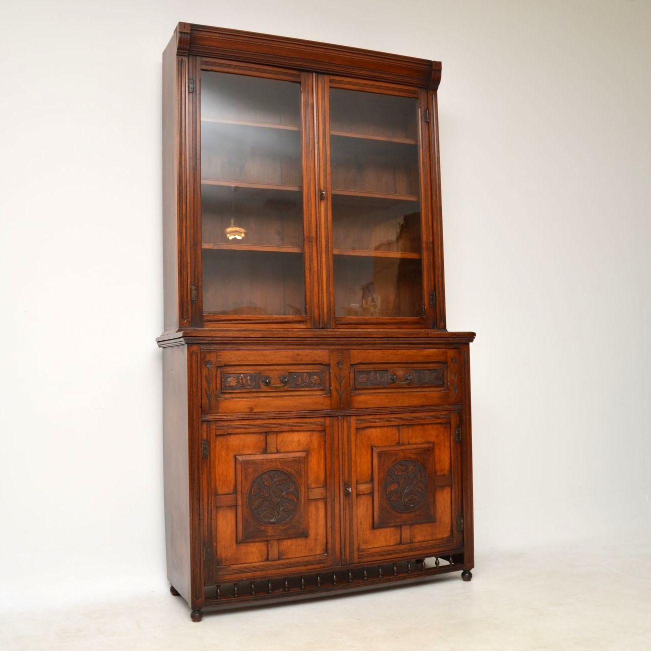 Very impressive large antique Victorian secretaire bookcase from the Arts & Crafts period in solid walnut dating from circa 1880s period. Please enlarge all the images to see all the great features. The bottom section has a pullout / pull-out