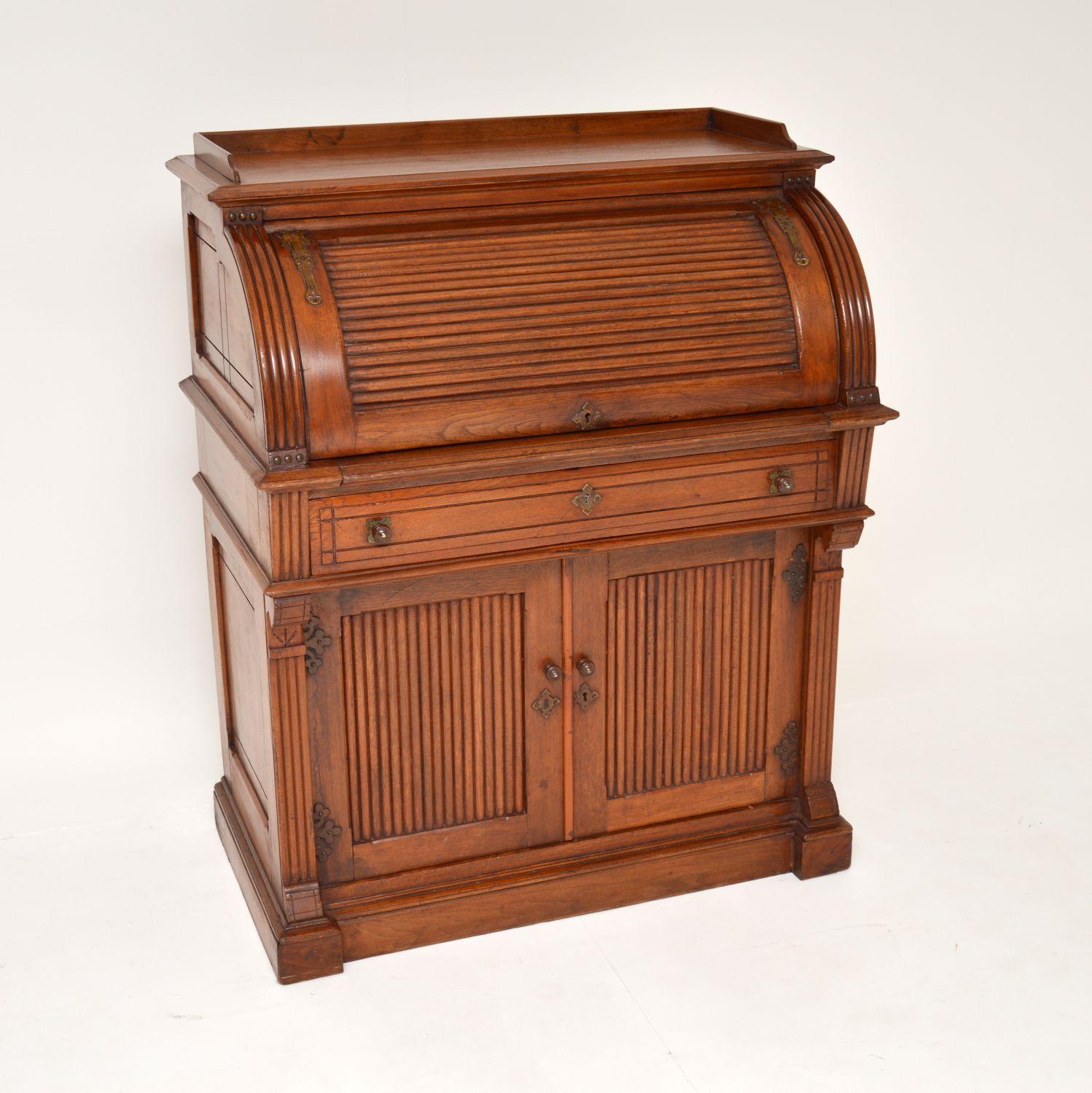 A superb original Victorian Arts & Crafts period tambour top bureau in solid walnut. This was made in England, it dates from around 1880-90’s period.

It is of amazing quality, with a beautiful and very practical design. There are gorgeous pierced