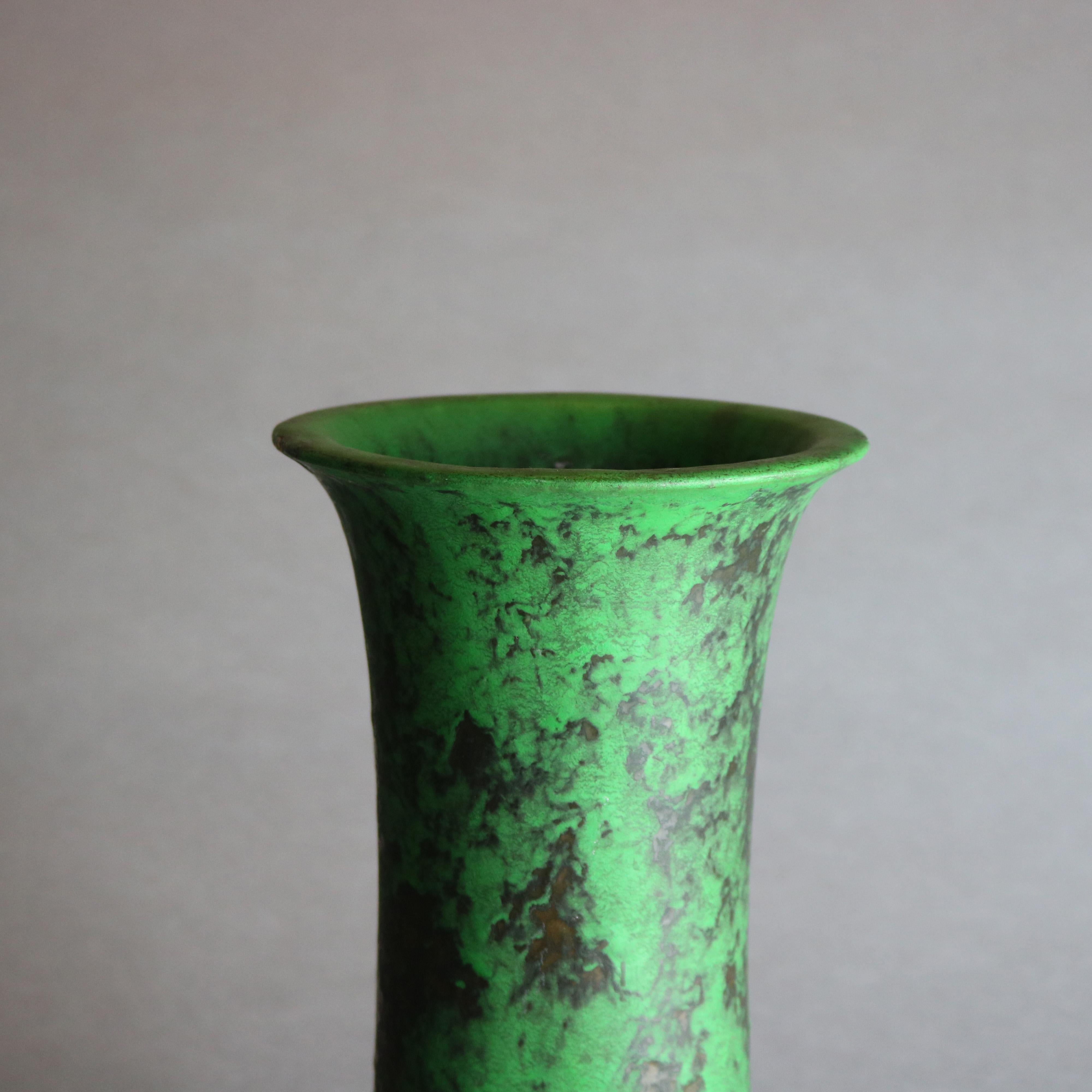 An antique Arts & Crafts art pottery vase by Weller offers cylindrical form with flared mouth and 
Coppertone glaze, signed on base as photographed, c1920

Measures: 12.5