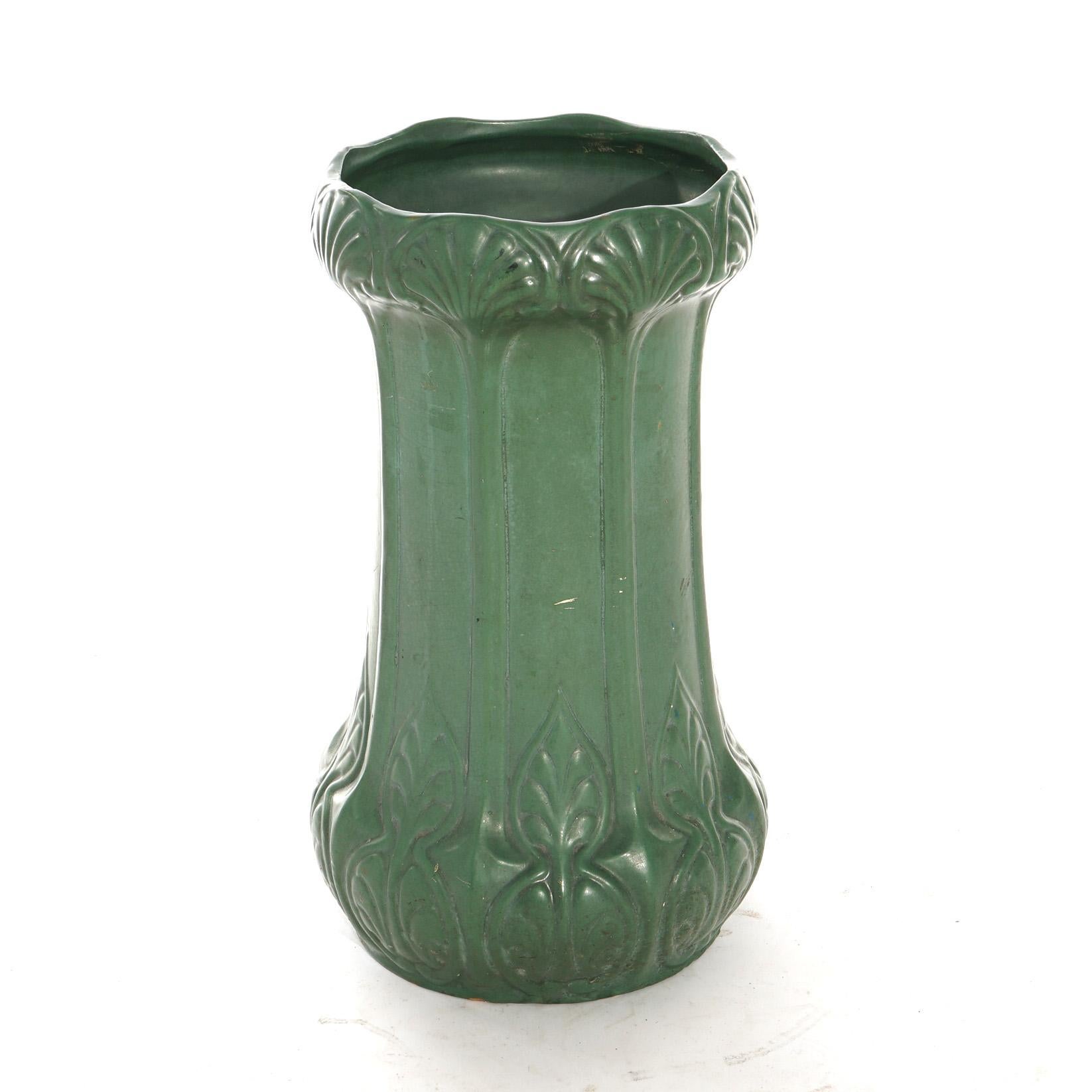 An antique Arts and Crafts Weller matte green art pottery umbrella stand with stylized foliate design, circa 1910

Measures - 22