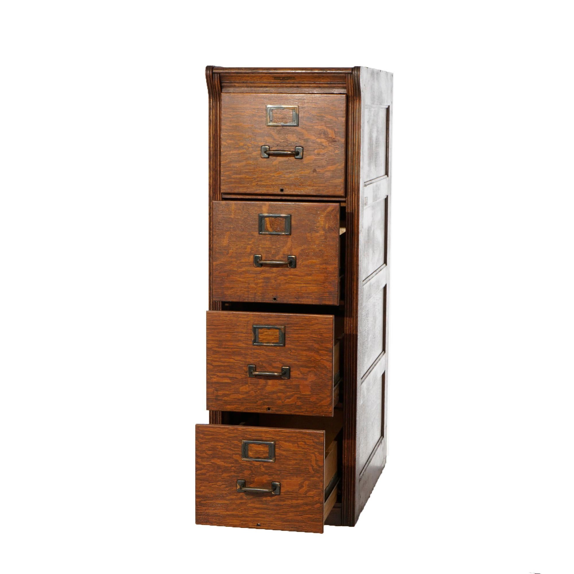 An antique Arts and Crafts filing cabinet by Yawman and Erbe offers quarter sawn oak paneled construction with four drawers, maker label as photographed, c1910

Measures- 53''H x 17.5''W x 28.75''D.