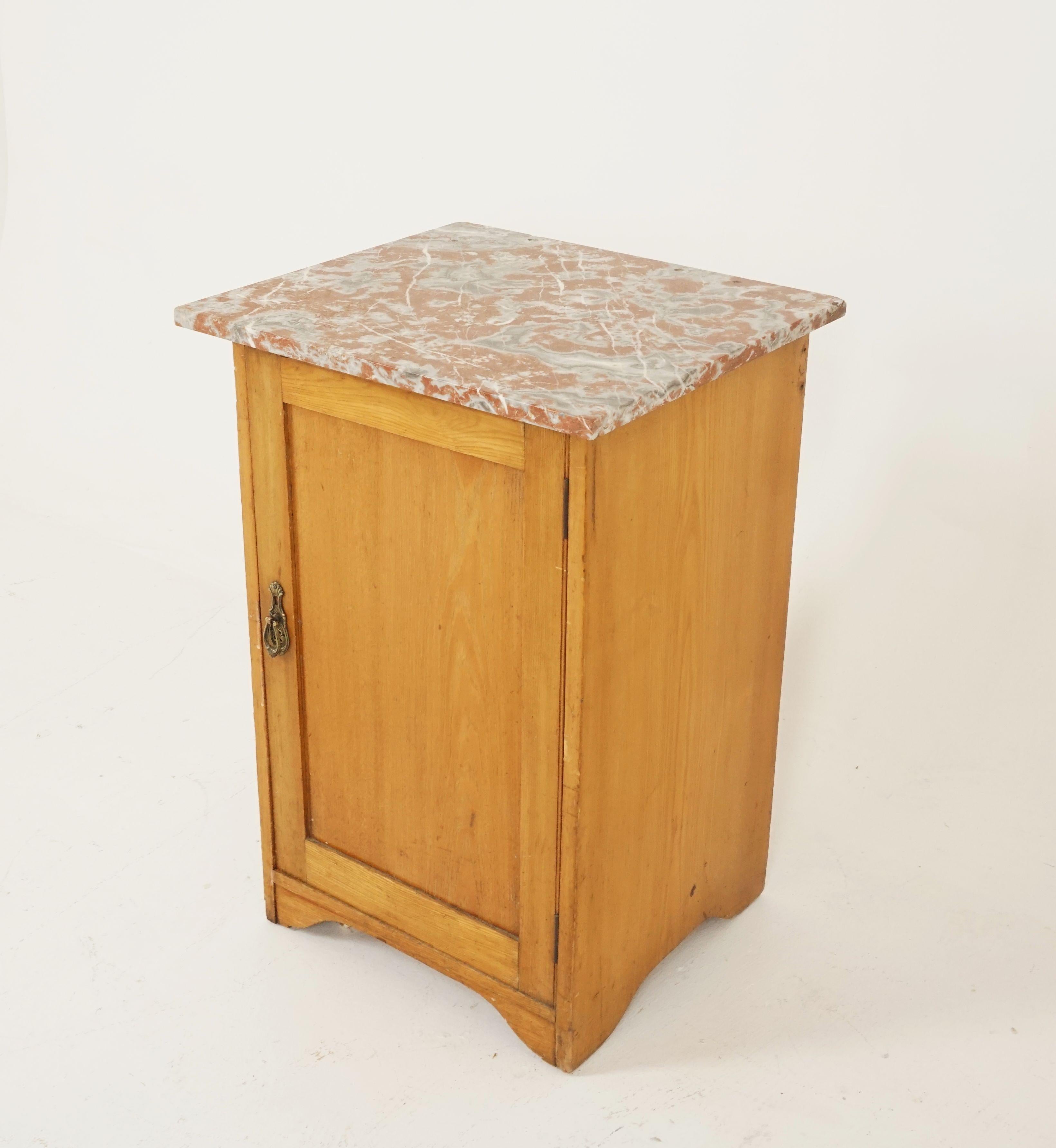 Antique ash nightstand, marble-top, lamp table, Scotland, 1900

Scotland, 1900
Solid oak
Original finish
Rouge marble top
Single door underneath opens to reveal single ash shelf
Original brass hardware
All standing on a plinth base
With
