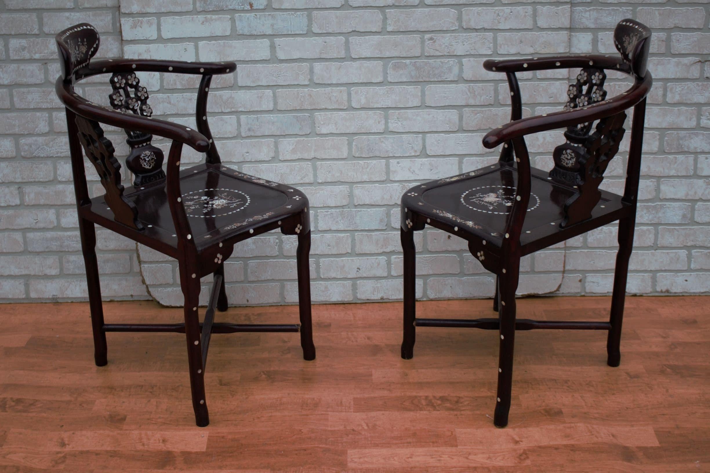 Antique Asian Carved Rosewood with Mother of Pearl Inlay Corner Chairs and Stool/Side Table - 3 Piece Set 

This beautiful set includes two rosewood hand carved horseshoe corner chairs and a stool/side table. All of the pieces are decorated with