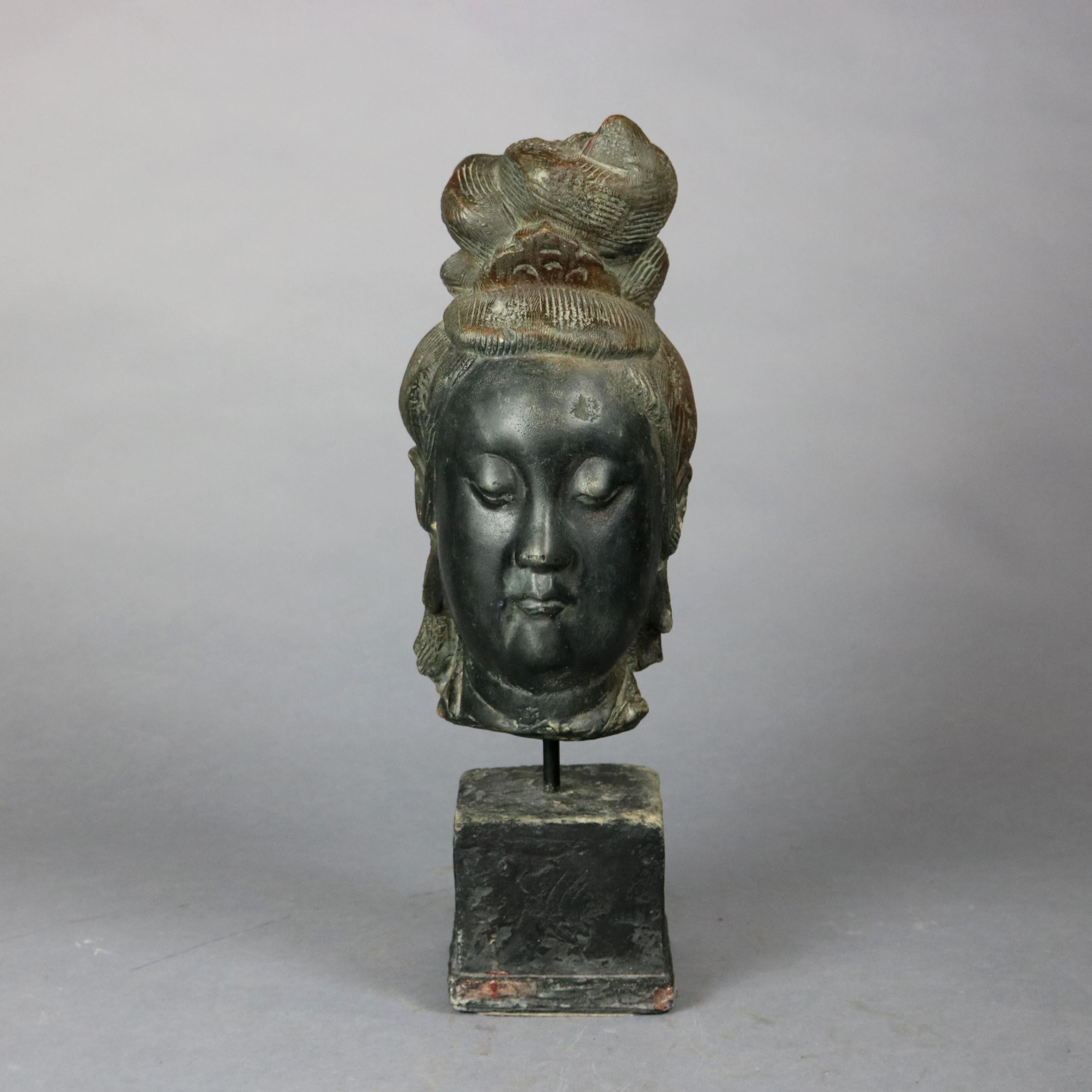 An antique Asian bust sculpture offers bronze or bronze clad Buddha mounted on post with base, c1930

Measures - 19.75'' H x 6.5'' W x 7'' D.