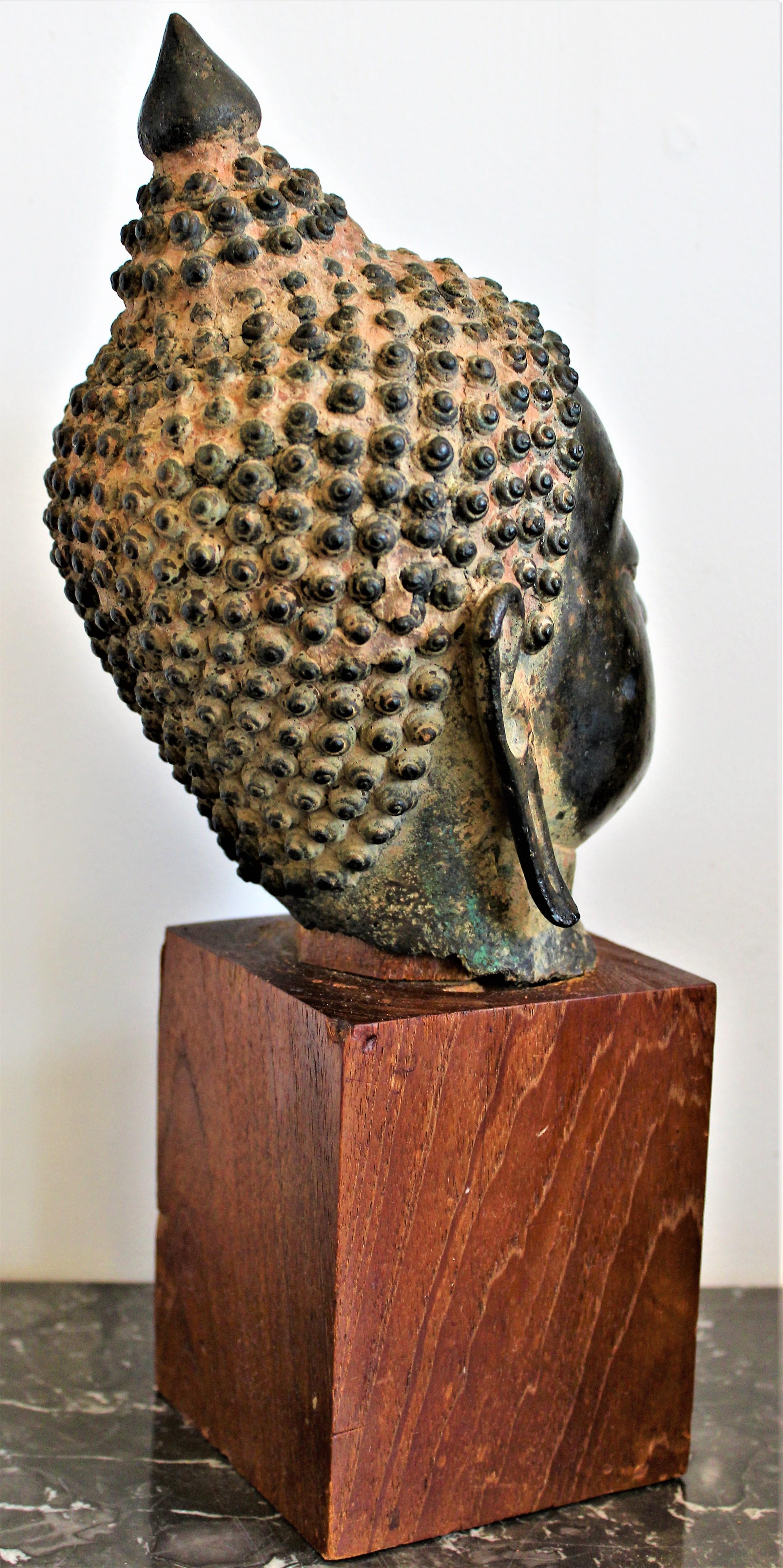 antique bronze buddha head