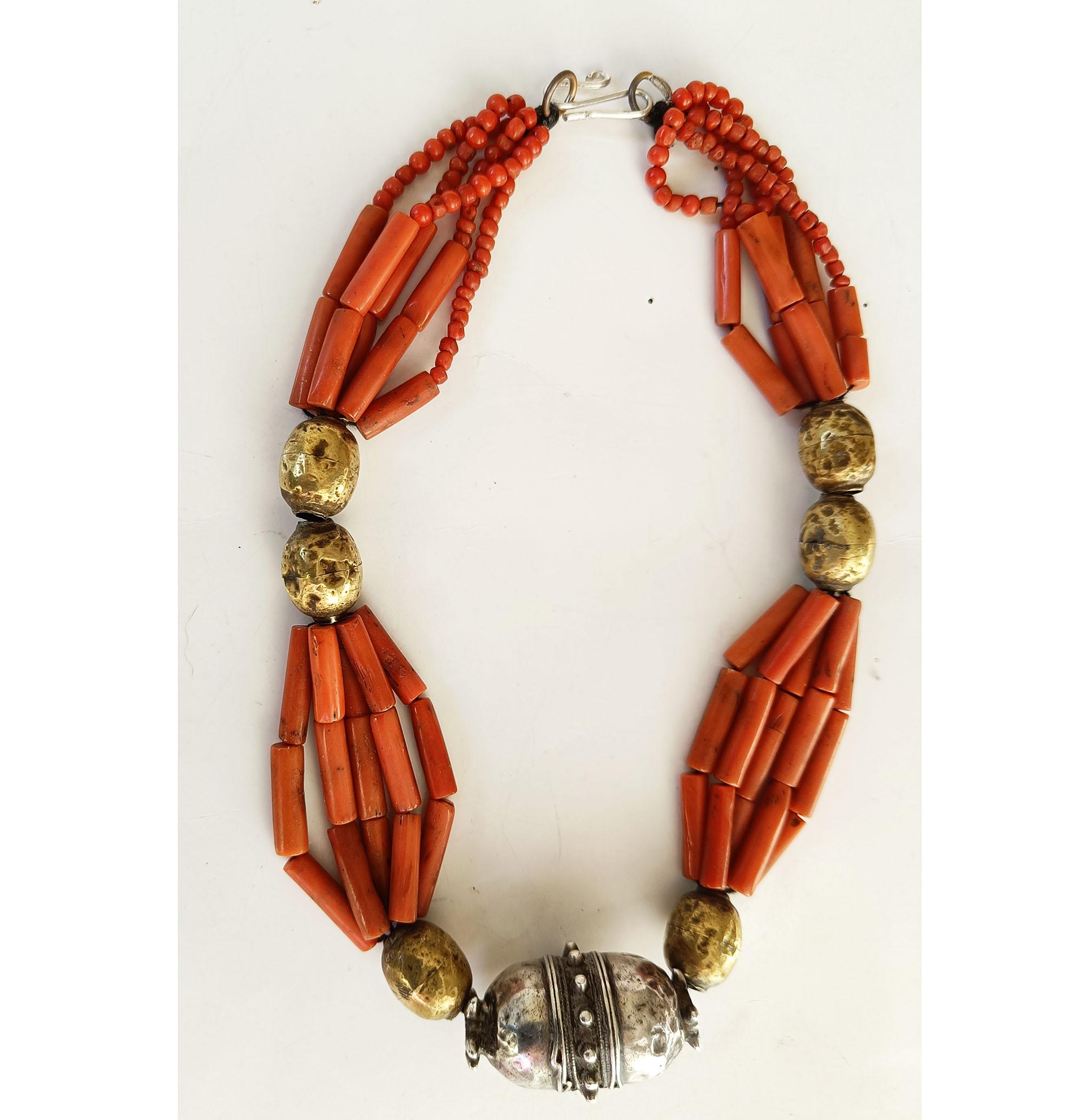  
Asian Ethnographic Tribal silver coral beaded necklace Vintage jewellery
A very nice antique Asian Ethnographic Tribal silver  gold gilt beads with long coral natural red tube beads and central silver bead  
Probably Afghanistan Period  19th