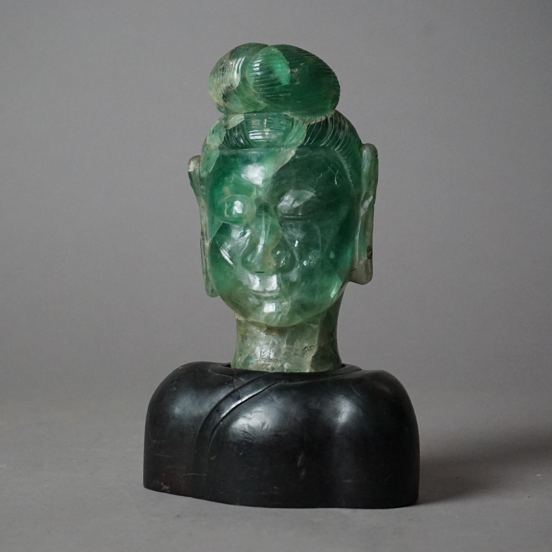 Antique Asian carved jade or quartz Buddha head sculpture on hardwood base circa 1920

Measures - 10