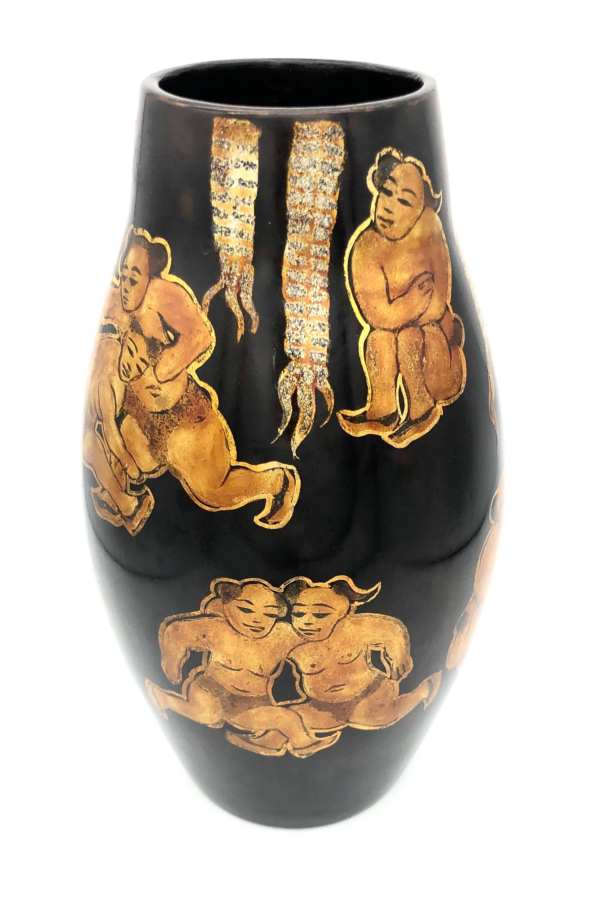 Unusual lacquer vase depicting wrestlers in different poses and a drummer. The figures and banderoles are painted with gold, silver and black color onto the brown/red lacquer.
The vase is signed on the base. 