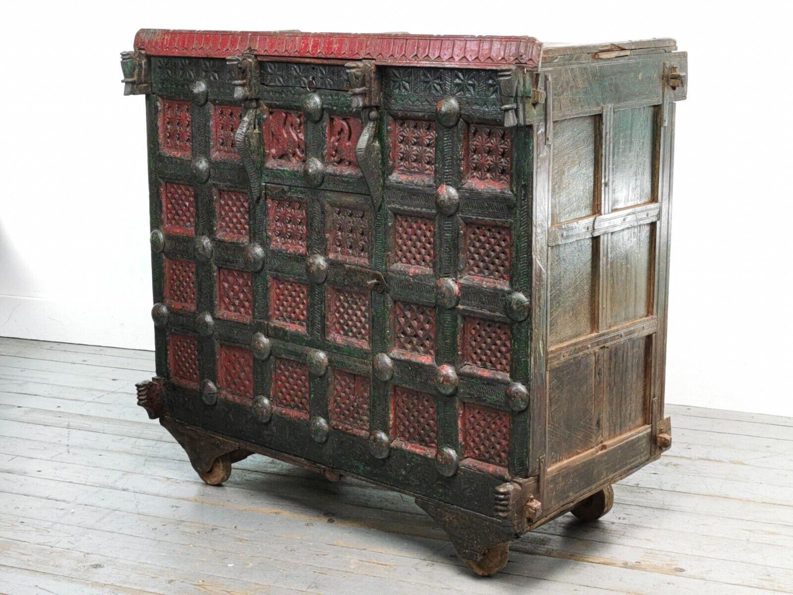 Antique Indian Damchiya with extensively carved wood. The traditional box was used as a dowry for Indian brides and gifted at weddings. It has panelled sides and secret compartments and was previously used to store clothing, household linen, and