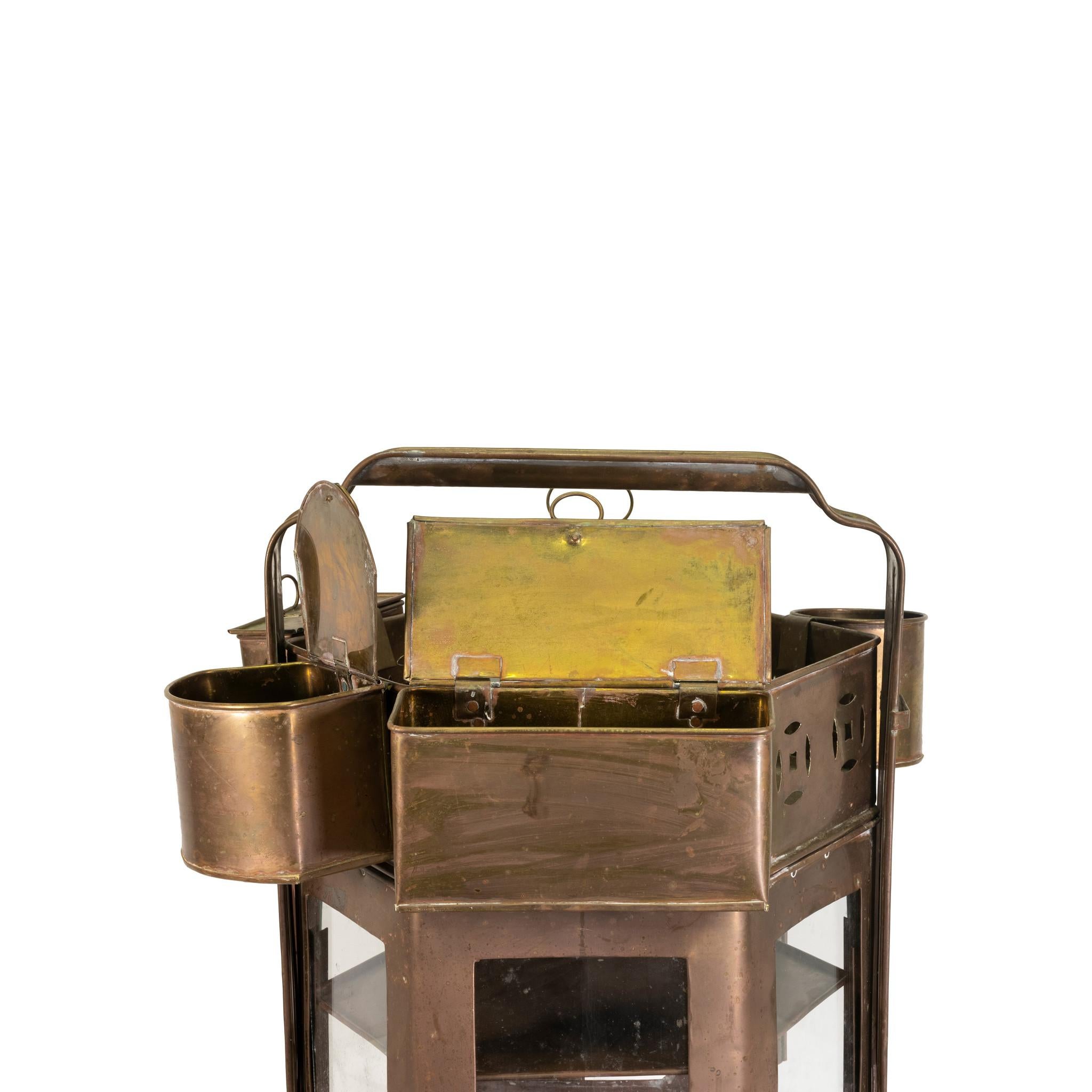 This was used by Asian street vendors to sell noodle dishes to the public. (Also known as a street vendor noodle cart). The unit has four glass panels, back opening door, a shelf and underneath compartment for coals. It has three hinged compartments