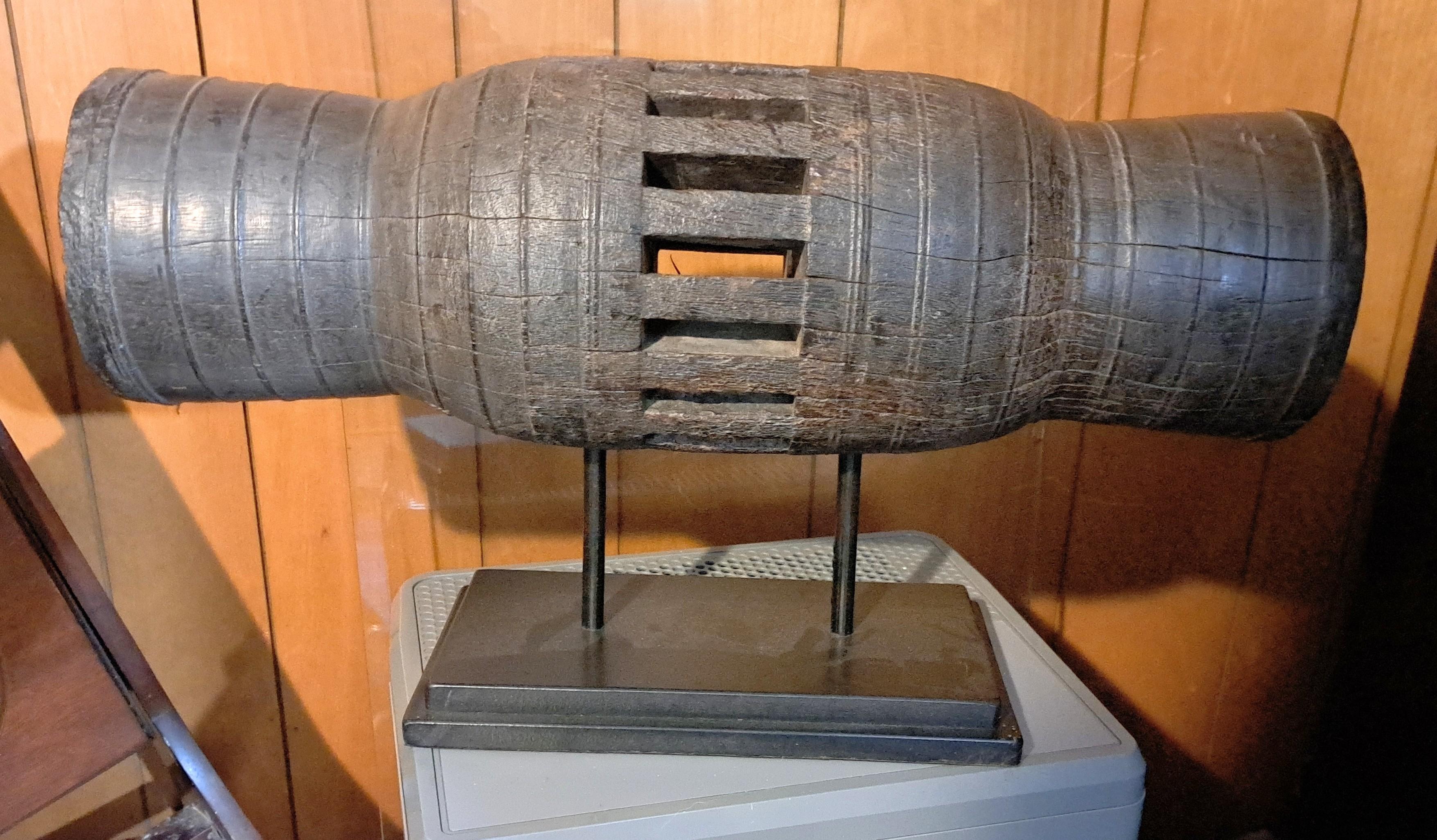 Antique Asian wagon wheel hub made of dense heavy wood that has been carved with spoke holes. Wood is patinated and as hard as metal.