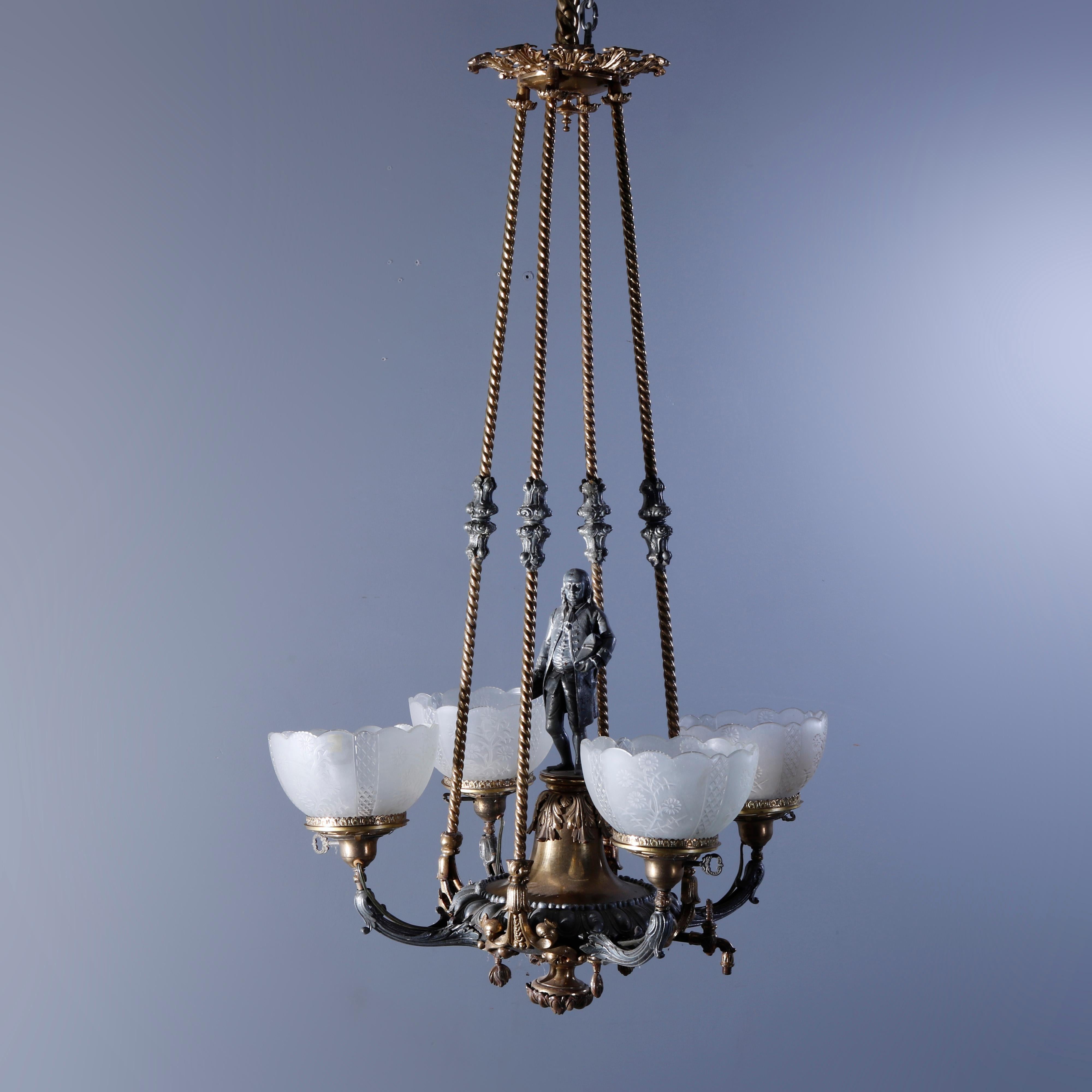 An antique figural gas chandelier attributed to Cornelius & Co. offers brass and white metal construction with central sculpture of Ben Franklin on font with acanthus foliate elements and four scroll form arms terminating in lights with floral