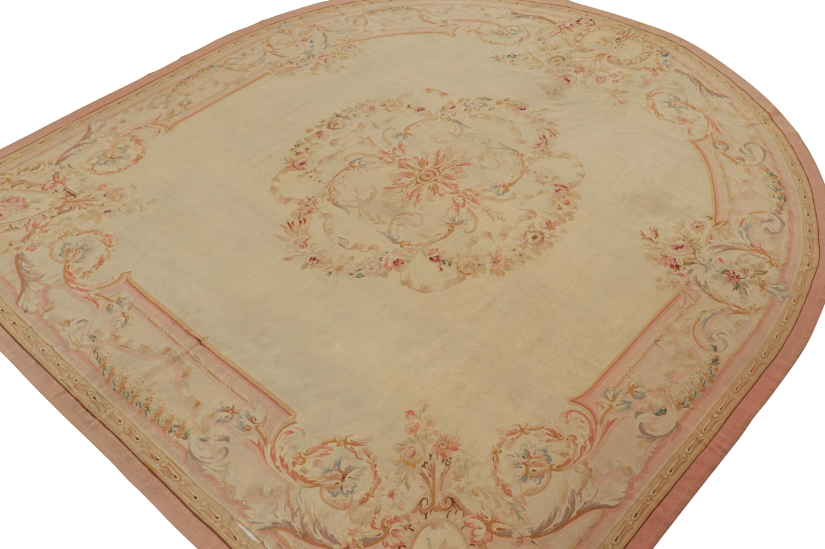 Handwoven in wool and hailing from France circa 1890-1900, this 11x12 antique Aubusson flatweave and round rug is an exciting addition in the Rug & Kilim Collection. An extremely collectible tapestry-style piece of this provenance, its design enjoys