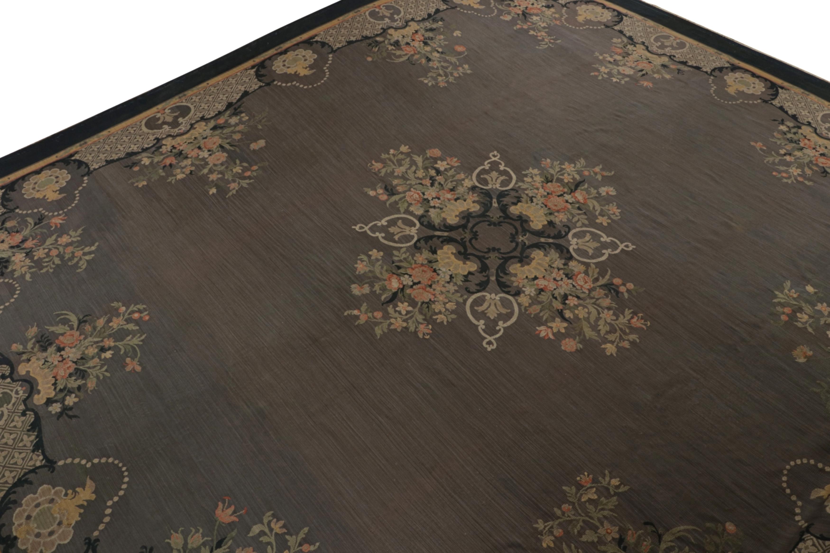 Handwoven in wool and hailing from France circa 1890-1900, this 17x19 antique Aubusson flatweave rug in gray features transitional French designs and Persian rug sensibilities of the Bidjar tradition. Its design is symbolic of the inspiration