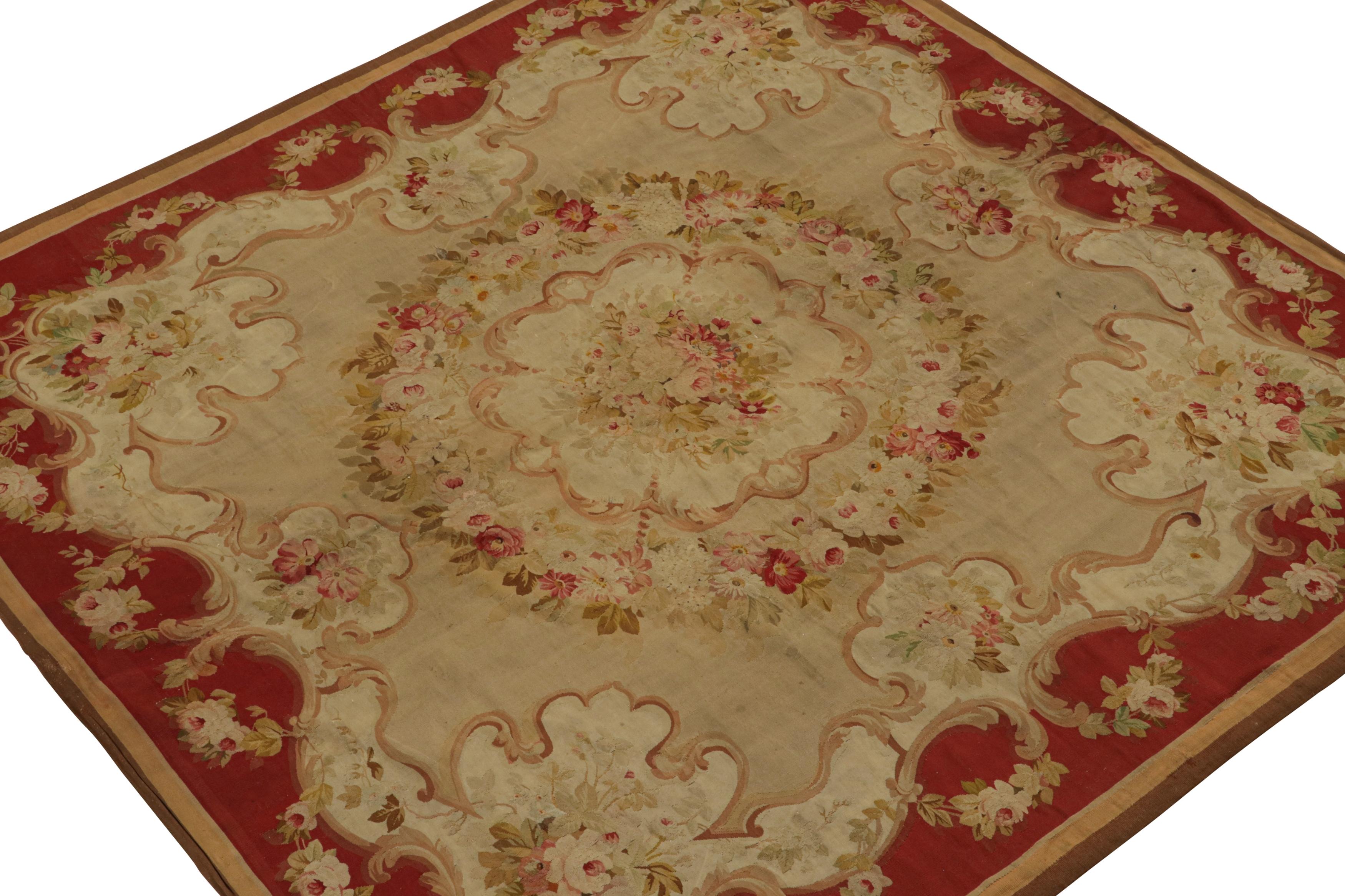 Handwoven in wool, circa 1890-1900, this 6x7 antique Aubusson flatweave rug in rich tones of beige and red, features floral medallions matching those in the spandrels, making it an elegant neoclassical artwork. 

On the design: 

As an exciting