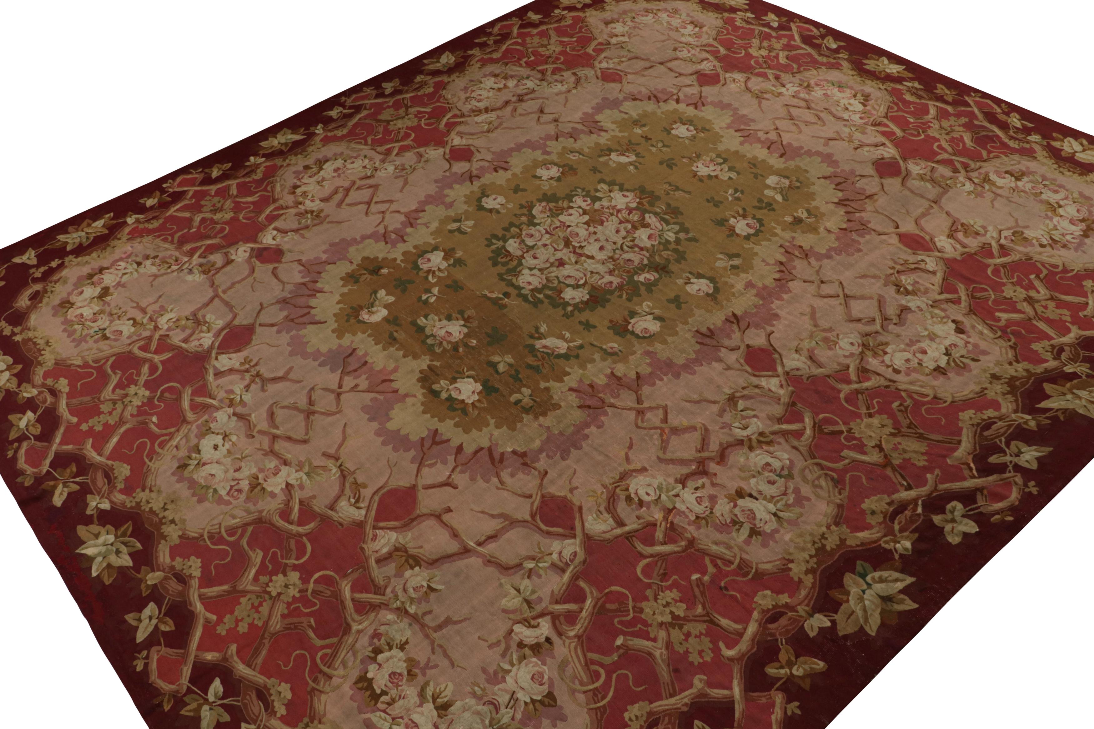 Handwoven in wool circa 1890-1900, this 13x16 antique Aubusson flatweave rug enjoys rich tones of red, brown and pink, with floral patterns in the field and the border. 

On the design: 

Admirers of the craft will note this is a collectible