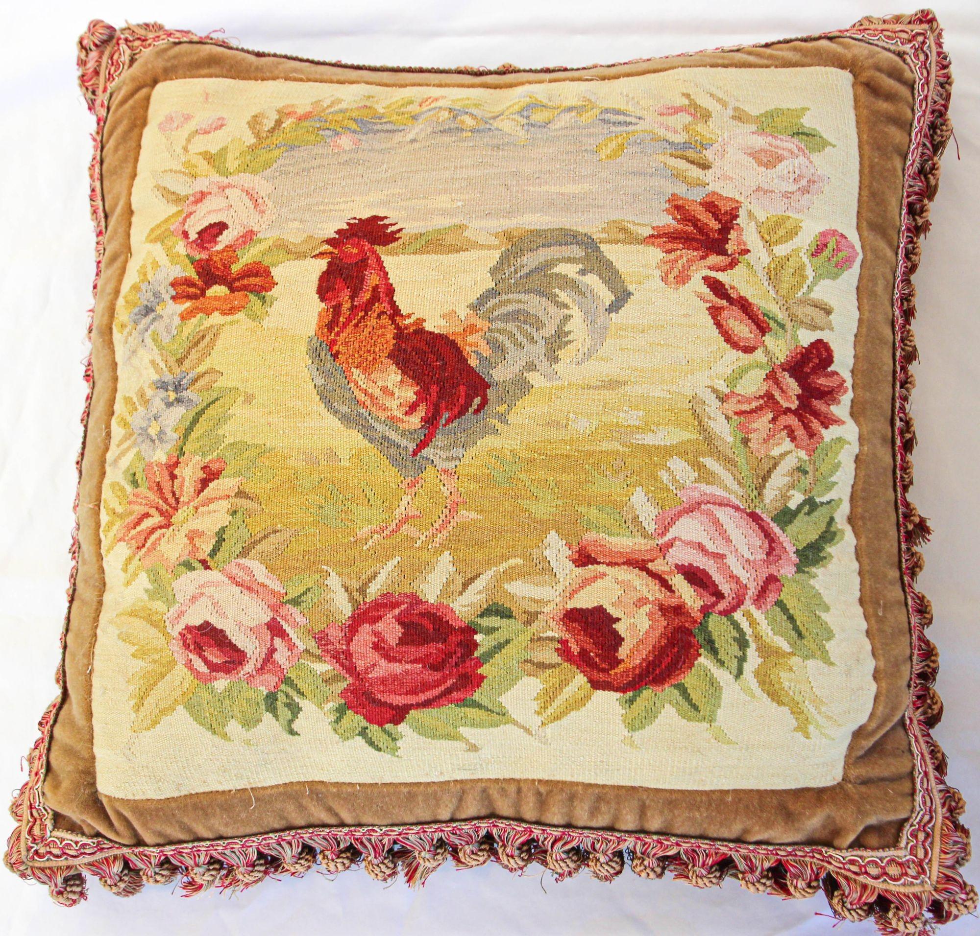 Antique French provincial Aubusson tapestries made into decorative pillows.
Large pair of French Aubusson pillows with a rustic design featuring a rooster in a field with a garland of full blown roses and flowers.
It is a woven Aubusson backed