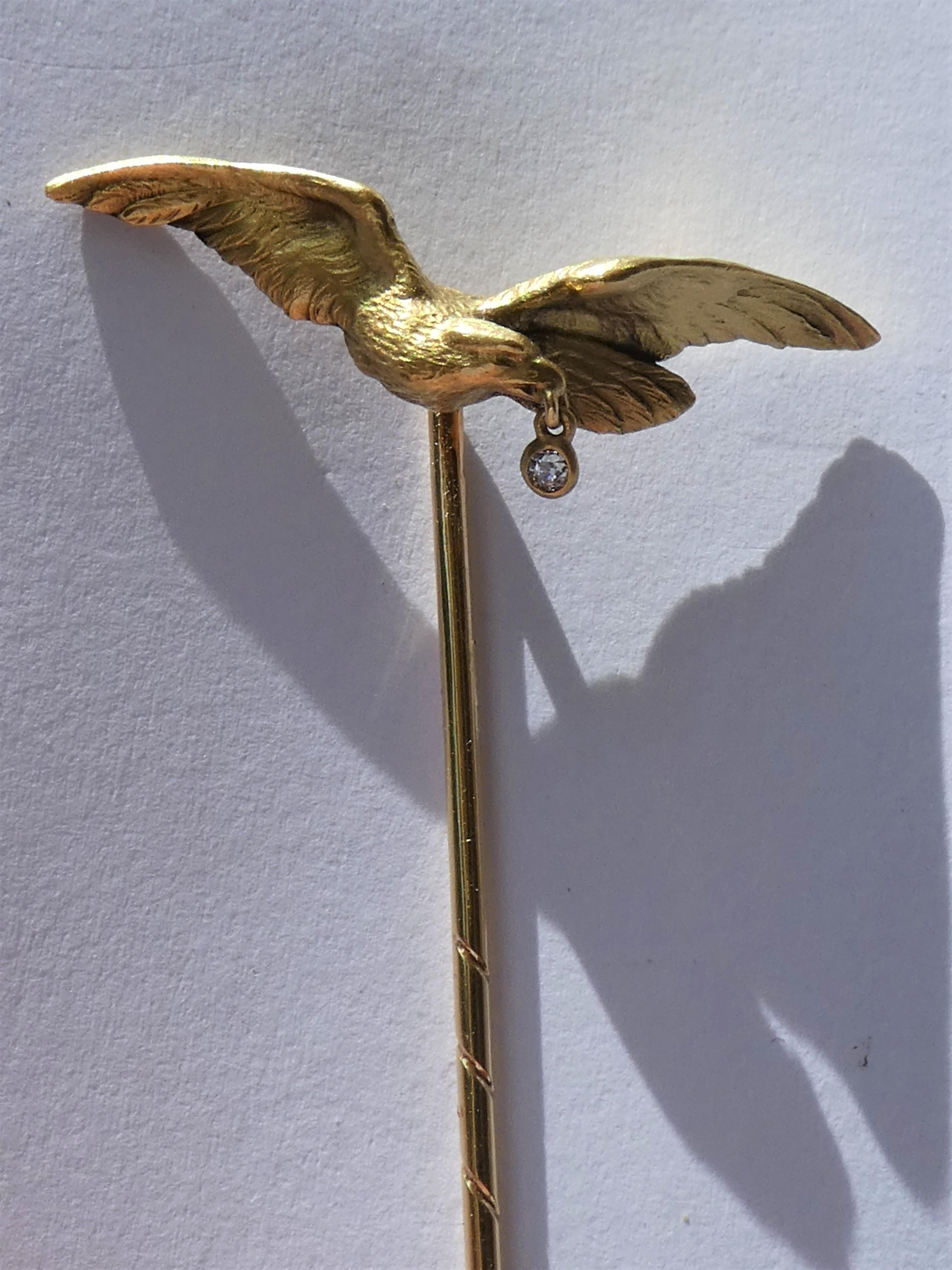This magnificent stickpin was crafted in Vienna around 1900 by a goldsmith with the initials A  & F in 14 karat brushed yellow gold. The craftmanship of the powerful spread eagle with open wings is detailed. It has this three dimensional look and