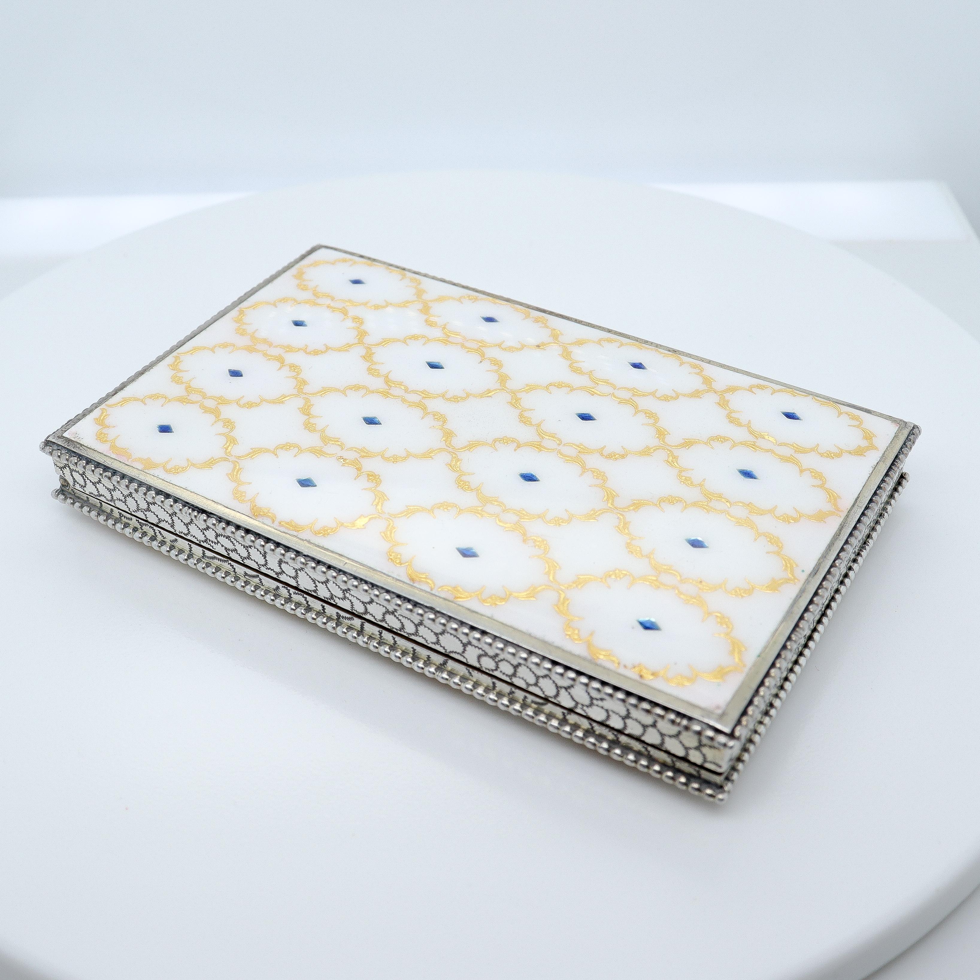 A very fine antique silver enamel box.

In Austrian 800 silver.

With white and blue polka dot panels decorated with gilt cartouches, beaded edges, engraved sides, and a gilt interior.

Fully marked to the interior with Austrian hallmarks.

Simply a