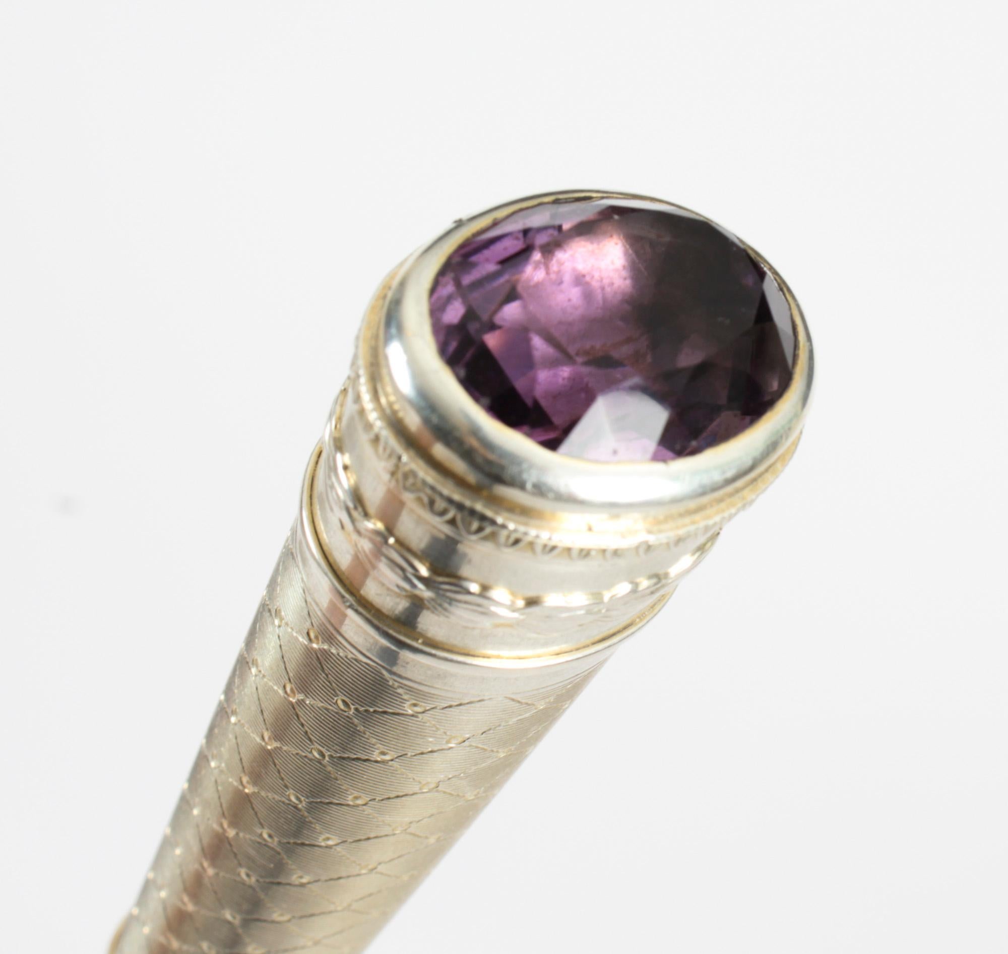 This is a superb Austrian neoclassical Revival Amethyst, Ebonised lady's walking stick, hallmarked George Adam Schied, Vienna, and dated 1900.
 
This decorative walking cane features a tapering handle surmounted with a large amethyst pommel. The