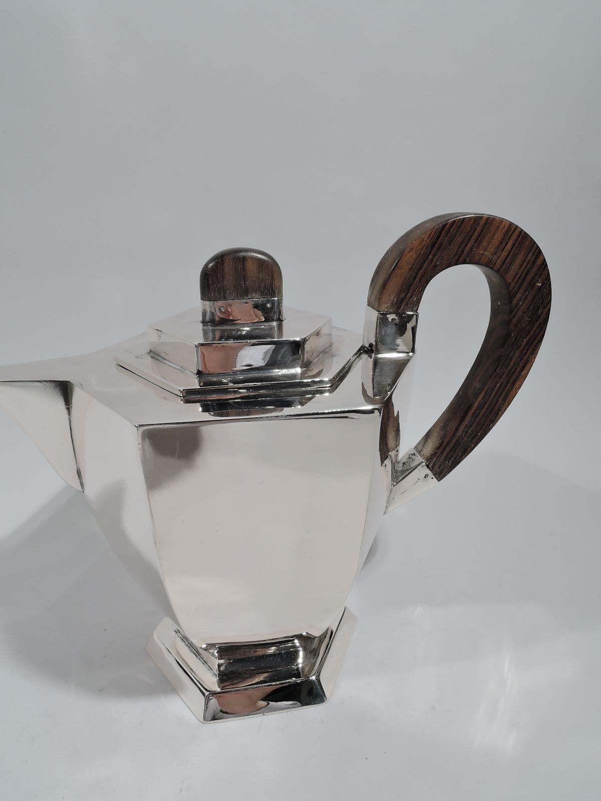 Austrian 800 silver 4-piece coffee and tea set on tray, ca 1920. This set comprises coffeepot, teapot, creamer, and sugar on tray. Each: Tapering hexagonal body on raised foot. Handles high-looping stained-wood. Covers stepped with stained-wood