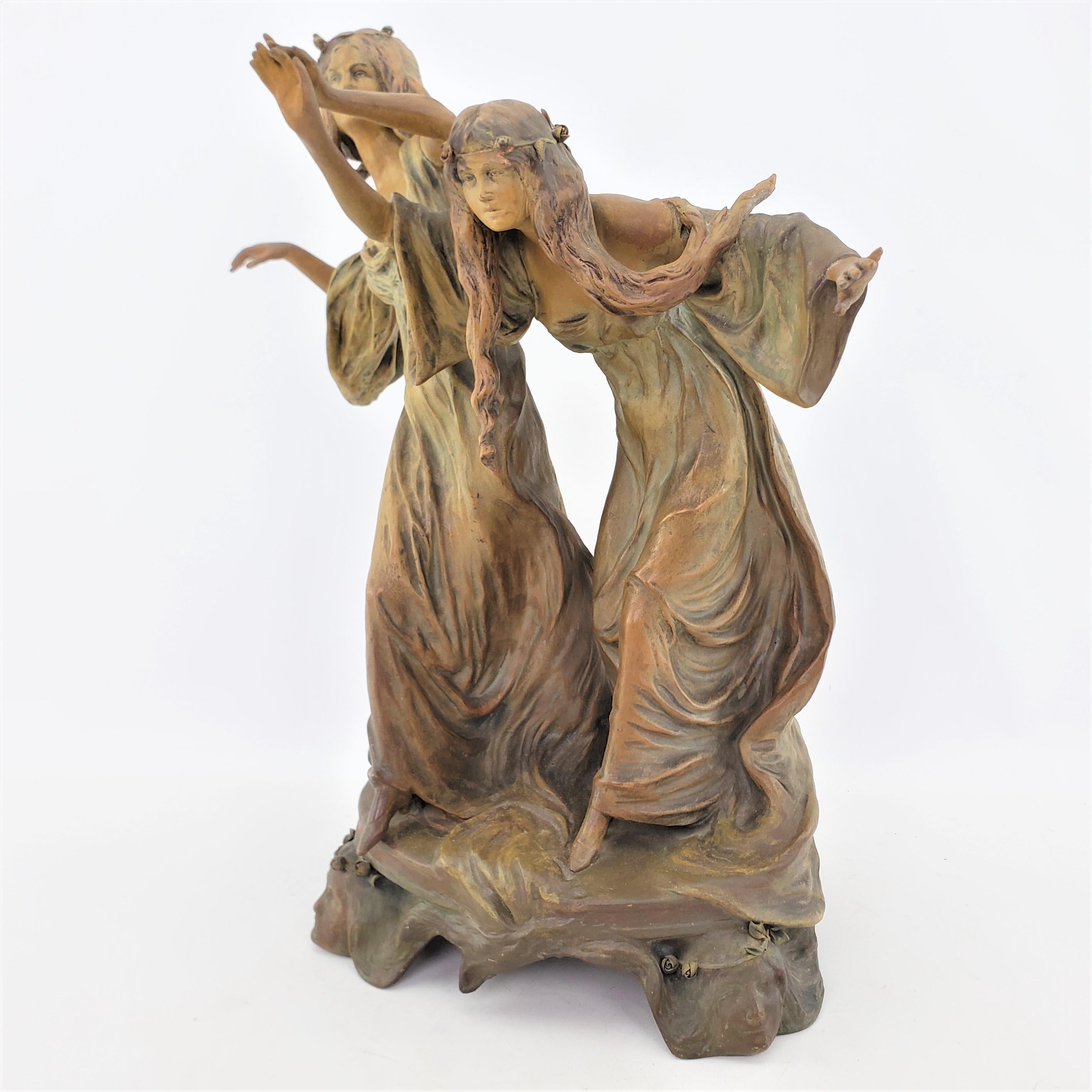 This large antique sculpture is possibly signed by an unknown artist, or titled and originated from Austria and dating to approximately 1890 and done in the period Art Nouveau style. The sculpture is composed of terracotta which has been patinated