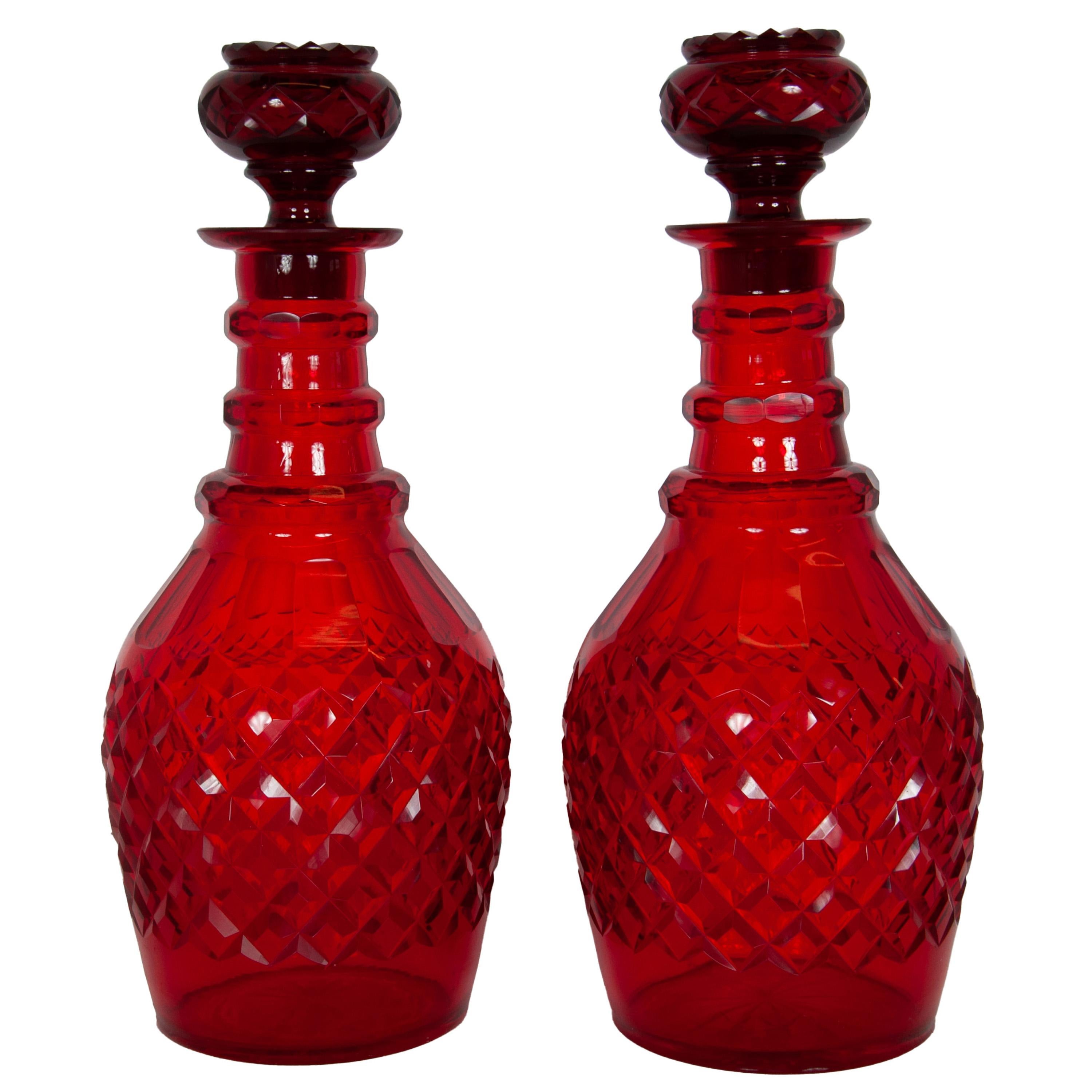 A fine & large pair of antique Bohemian cut glass red wine/liquor decanters with stoppers, circa 1880.
This very fine pair of decanters are in remarkable condition, each decanter has the original stopper of compressed circular form with diamond cut