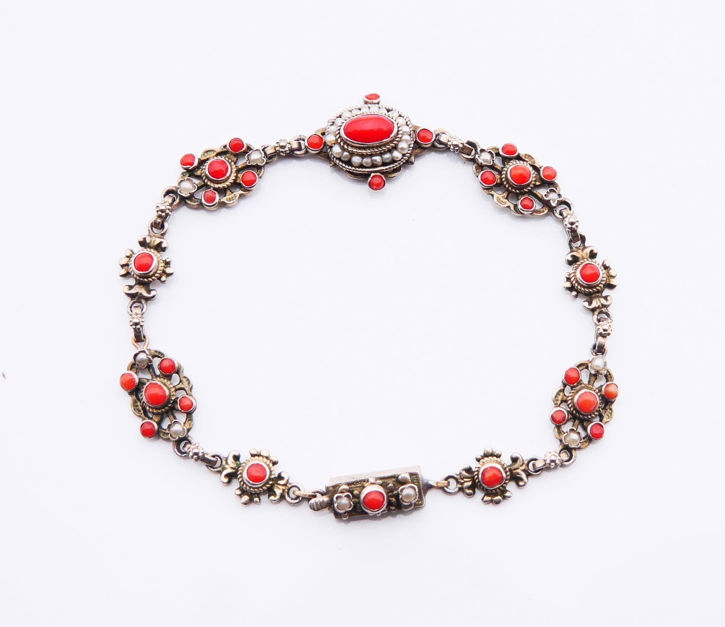 Rare and striking Renaissance Revival Austrian Bracelet. Complexly structured and one-of-a-kind design, lavishly decorated with natural polished Red Coral cabochons and selected miniature Oriental Pearls. 

Hand - made ca.  late 19th  - early 20th