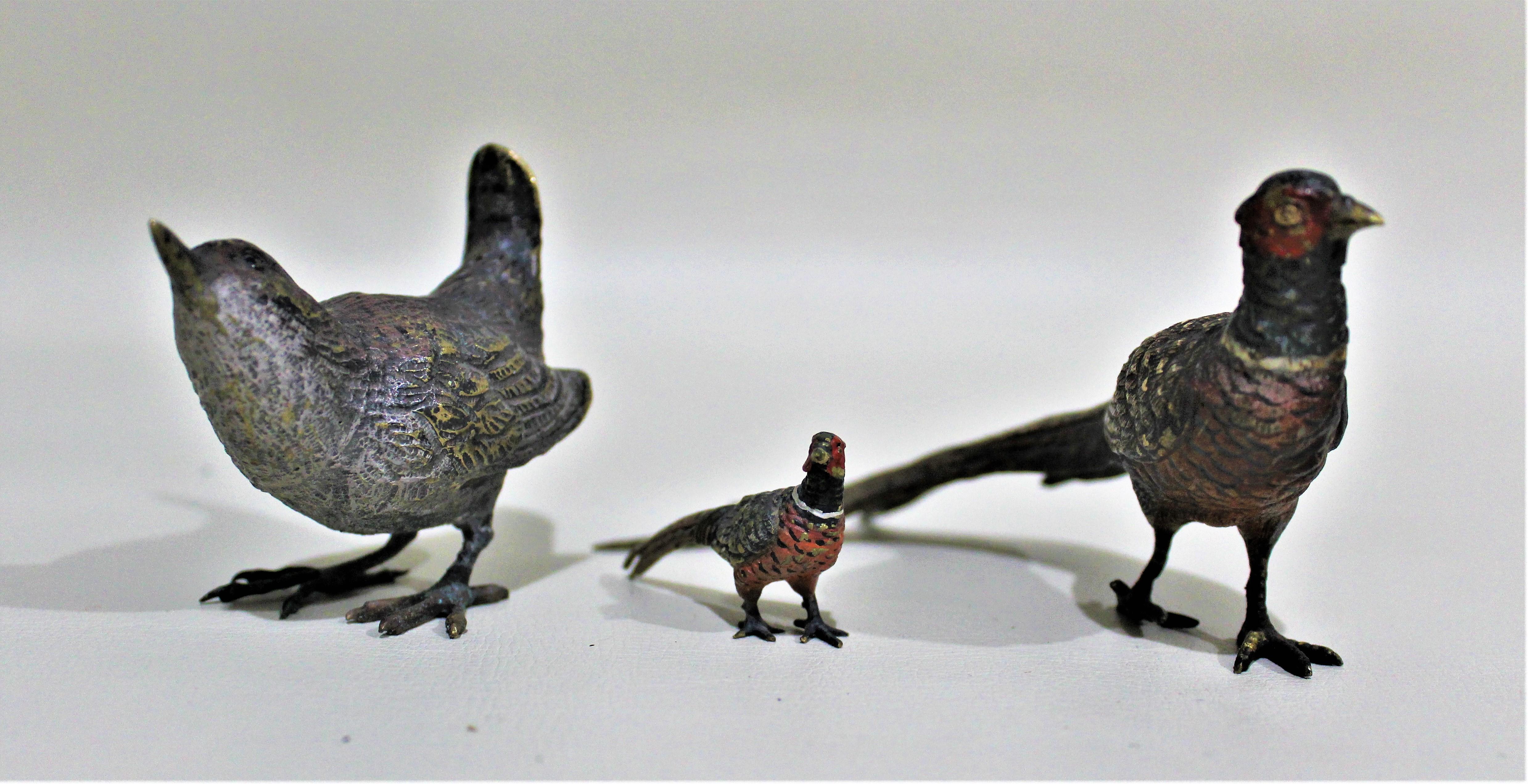 Lot of three detailed cast and cold-painted Austrian bronze bird figures dating from approximately the 1900-1920s time period. The cast figurines are highly detailed showing, for example, individual feathers and are cold painted in a realistic