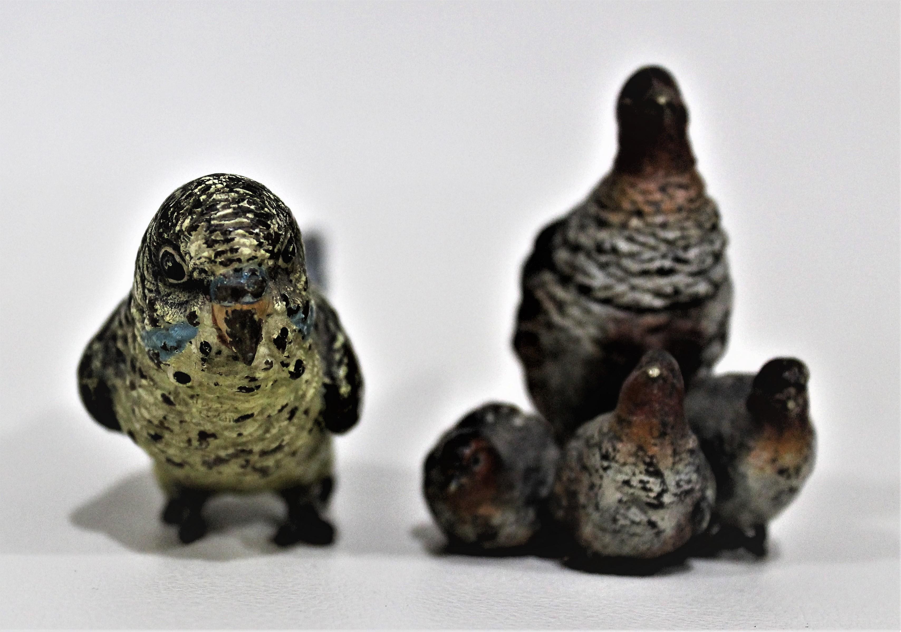 Lot of two detailed antique Austrian cast and cold painted bronze miniature bird figurines dating from approximately the 1900-1920s time period. The cast figurines show intricate detail, for example, individual feathers, and are cold painted in a