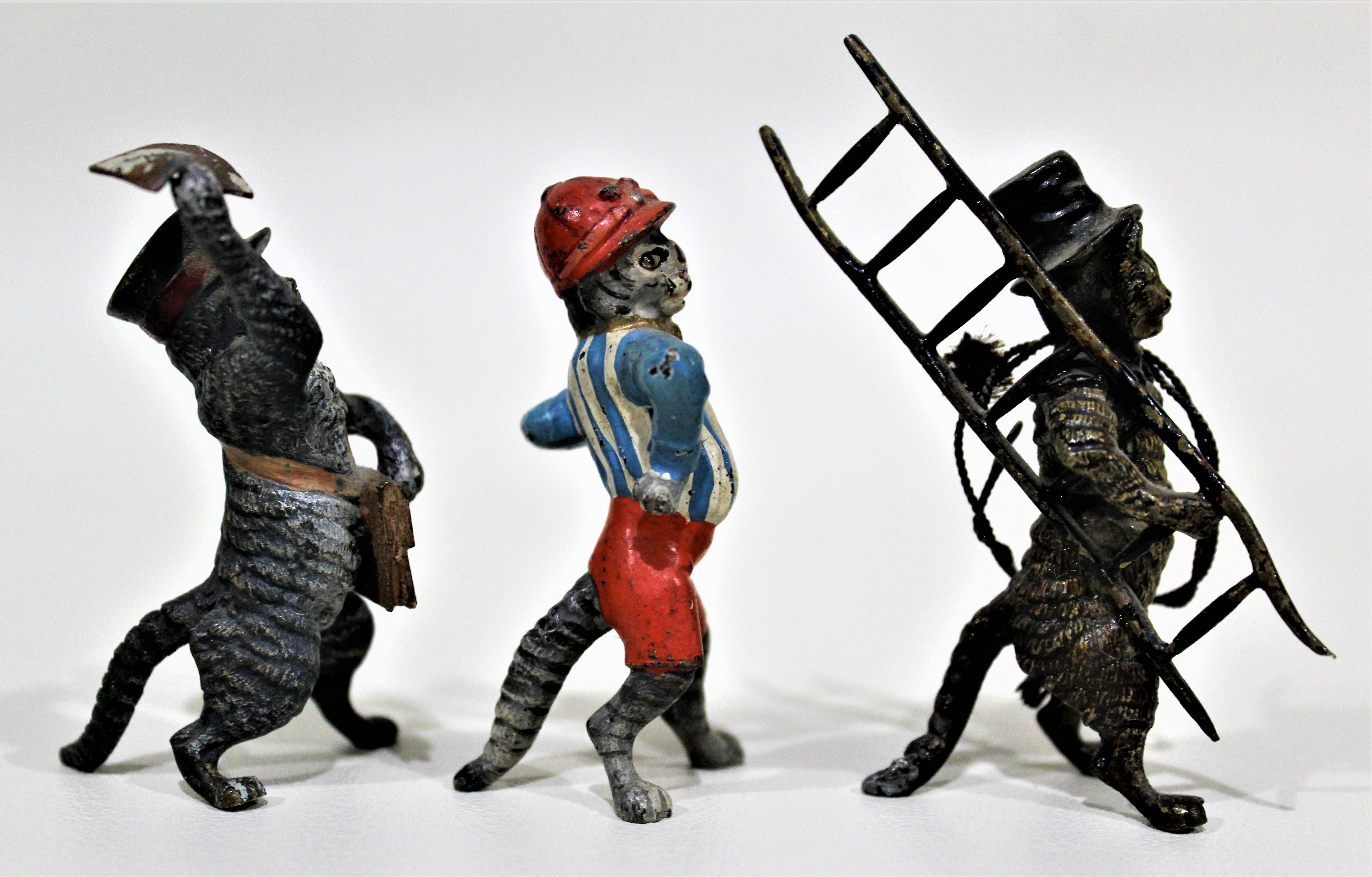 Lot of three ornately cast and cold-painted antique Austrian bronze miniatures of whimsical cats. These highly detailed sculptures date from approximately 1900-1920.

Approximate dimensions of figurines: (L/W/H)

Cat 'Paper Boy': 1.5 x 1.5 x 2.5
Cat