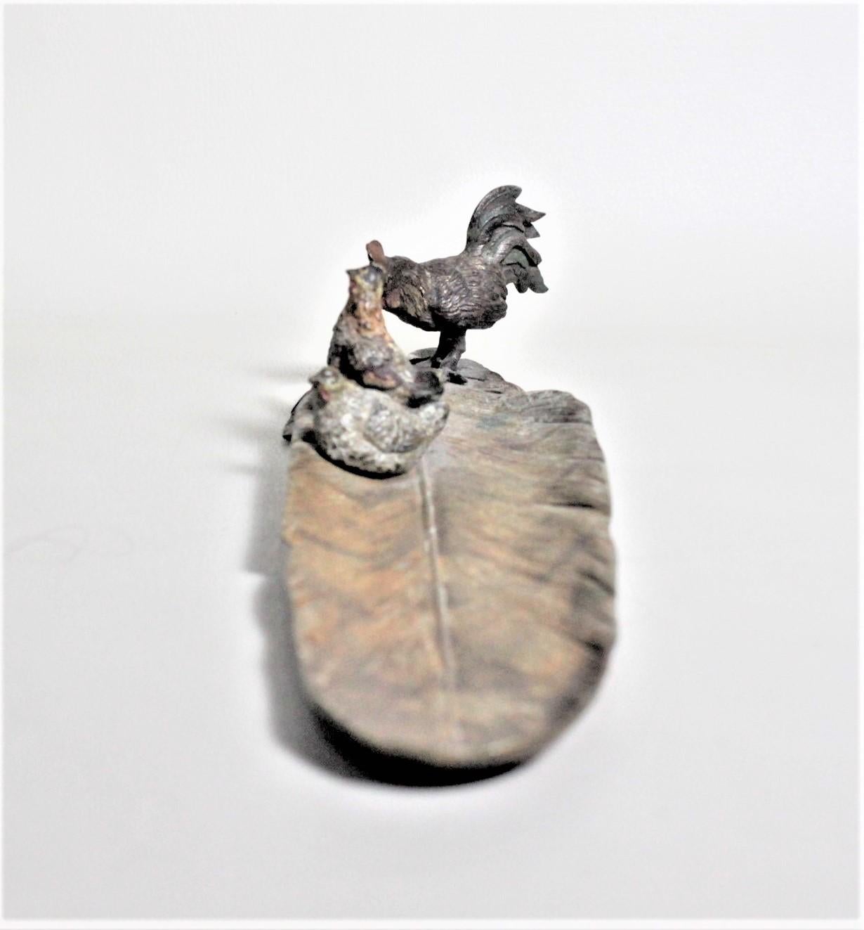 Cast Antique Austrian Cold-Painted Bronze of a Rooster and Chickens Perched on a Leaf