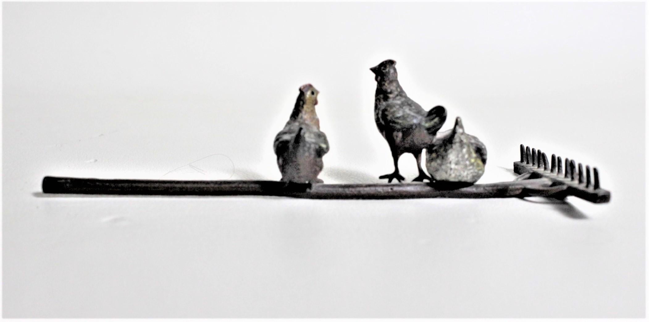 Cast Antique Austrian Cold-Painted Bronze of Chickens Perched on a Rake Sculpture