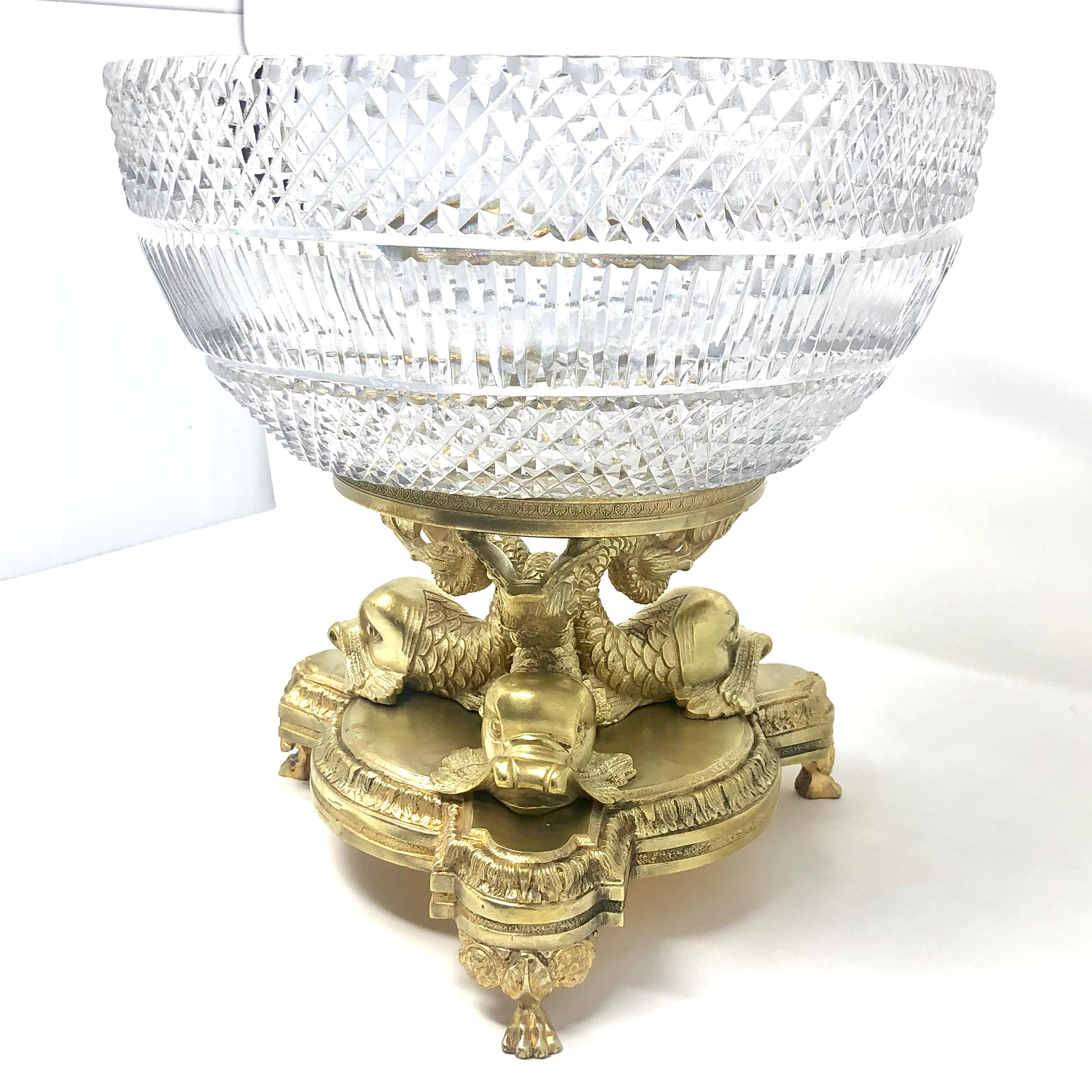 Exceptional quality Antique Austrian cut crystal and gold bronze centerpiece, 1900-1910. Crystal Bowl sits on a fine gold bronze stand with figural dolphinfish at base.