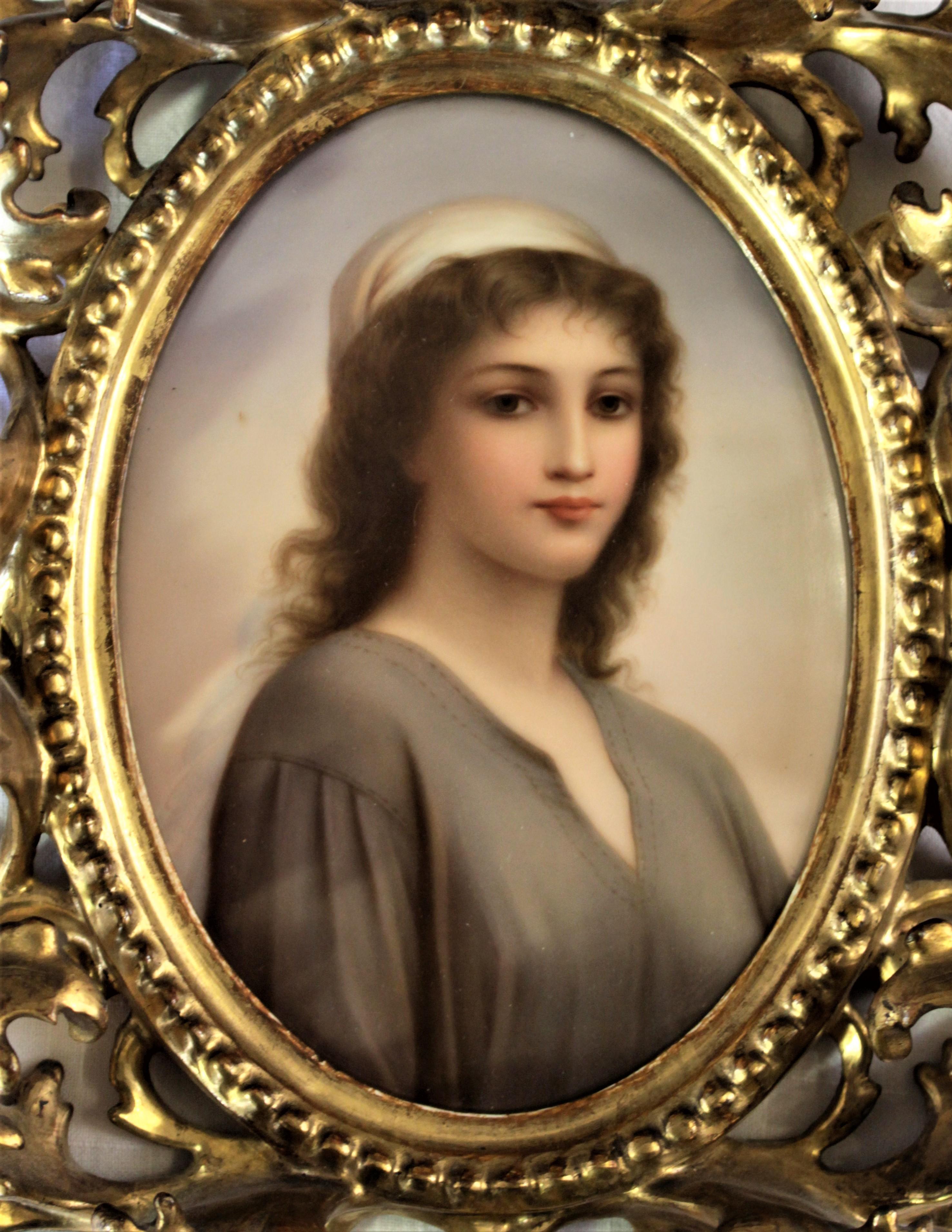 This antique hand painted porcelain medallion of the Biblical 'Ruth' is unsigned but presumed to have been done in Austria in approximately 1880 in the Royal Vienna style. The hand painted portrait is very well executed and accented by a very